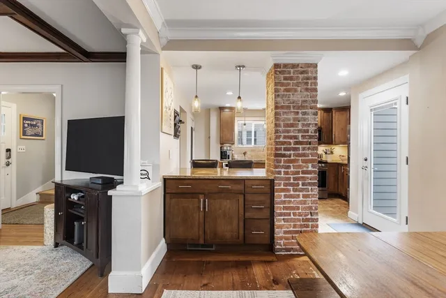 a kitchen with a refrigerator and a sink