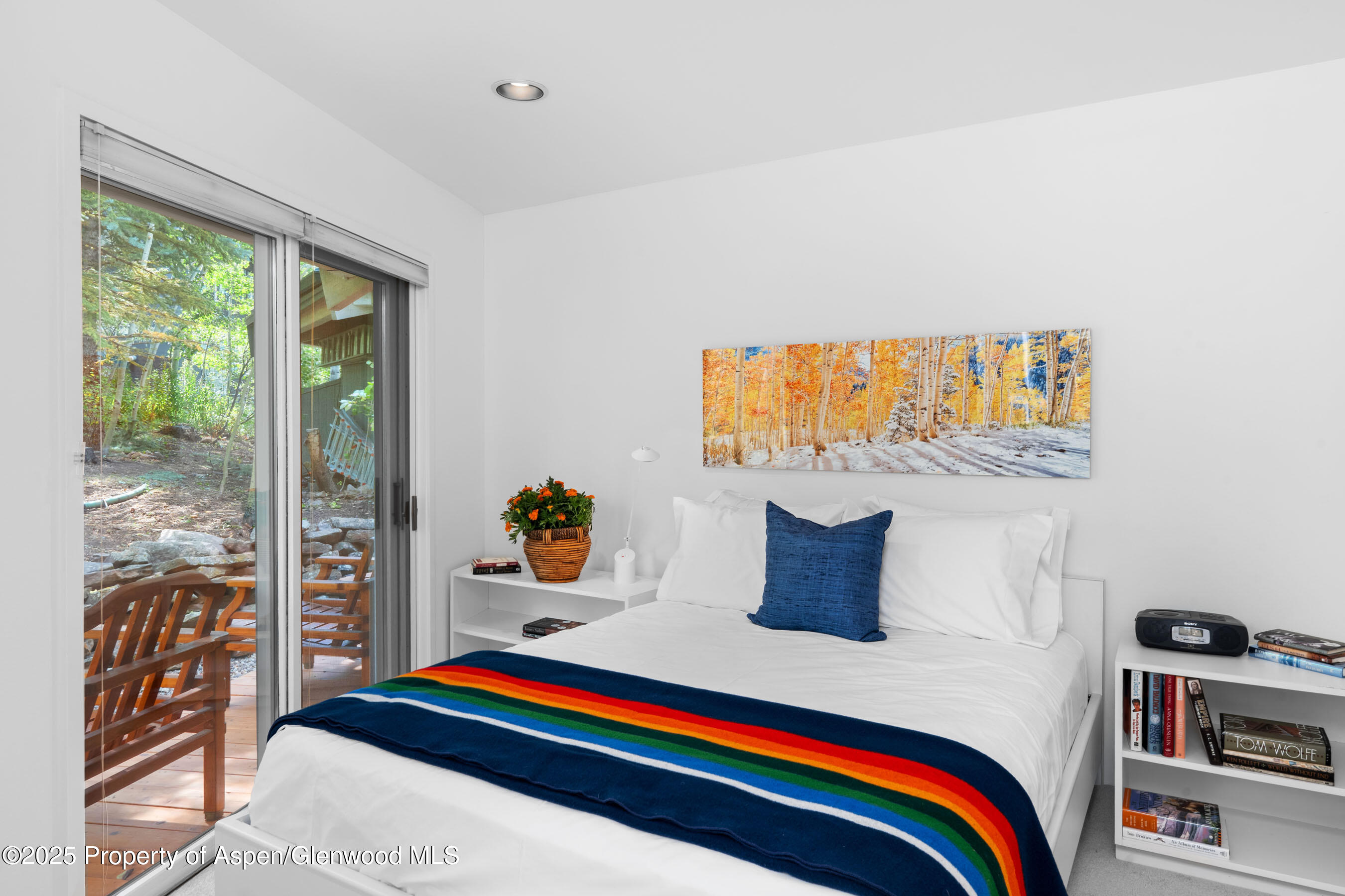 239 Antler Ridge Lane Snowmass Village, CO 81615 - Photo 25 of 50 a bedroom with a bed and wooden floor