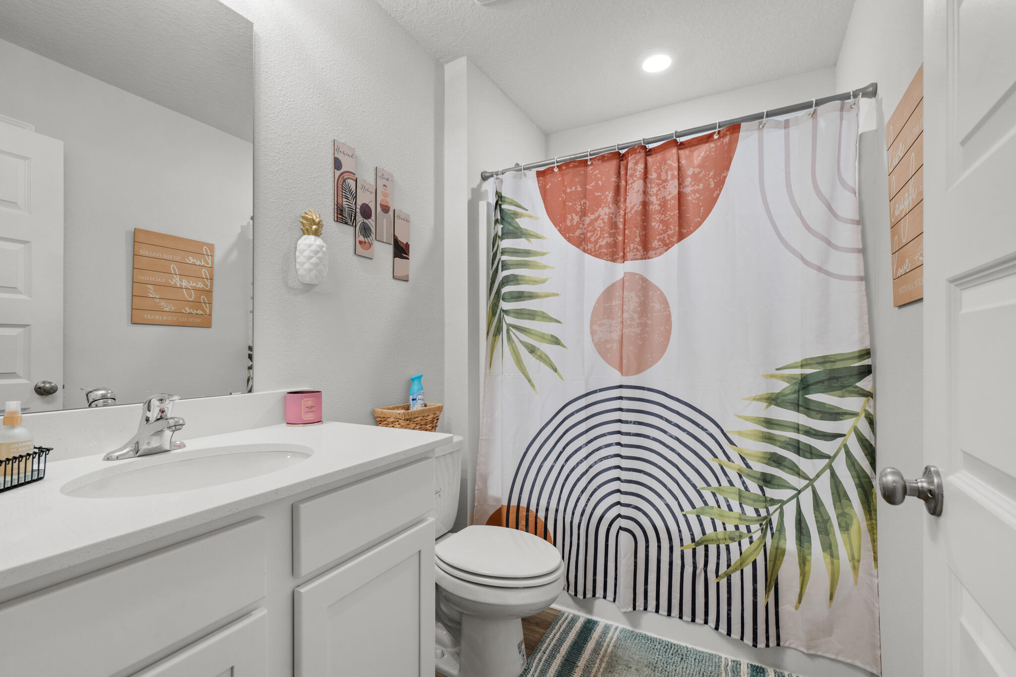 557 Mary Lou Way Crestview, FL 32539 - Photo 11 of 11 a bathroom with a sink a toilet and a mirror