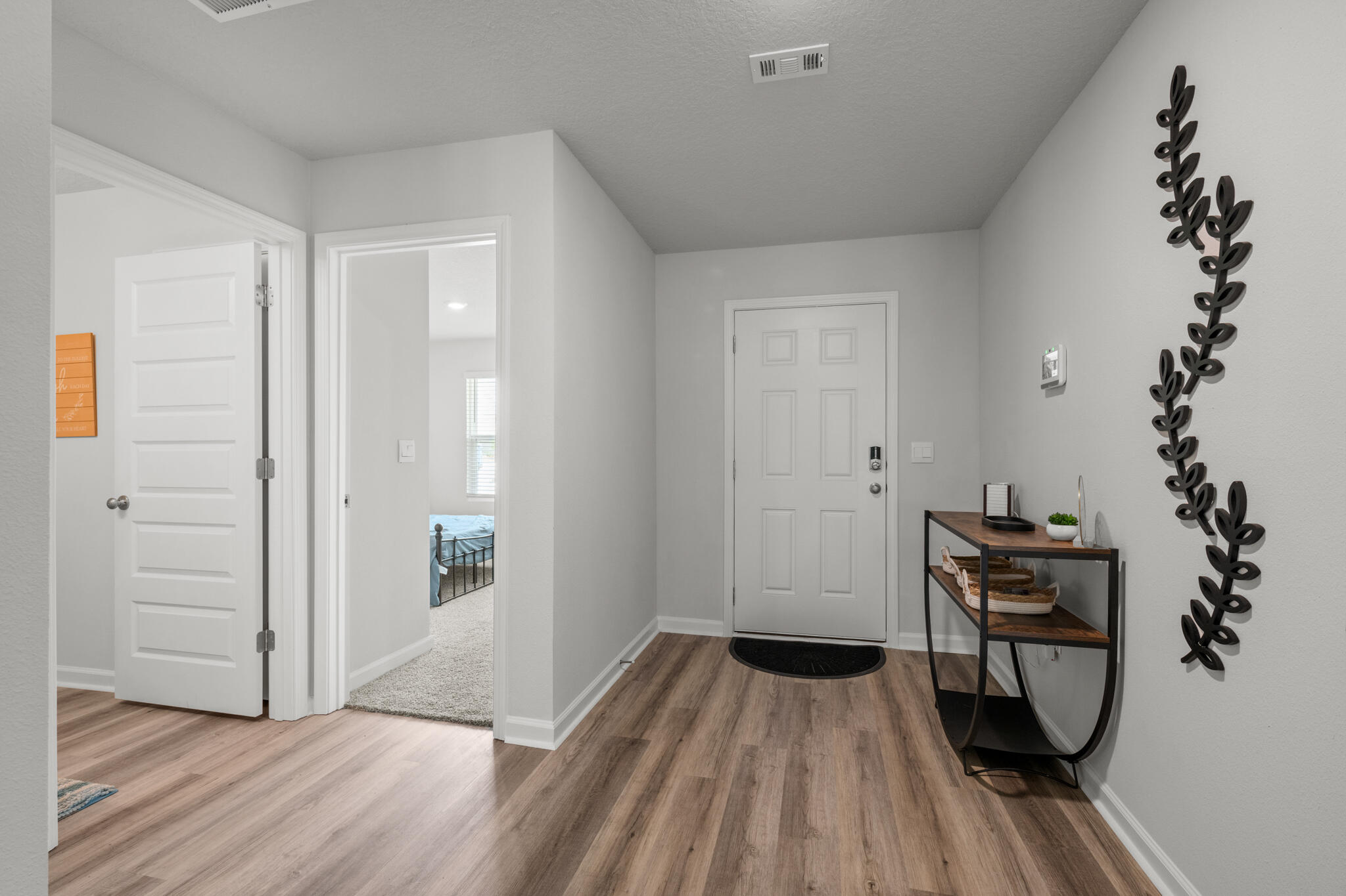 557 Mary Lou Way Crestview, FL 32539 - Photo 2 of 11 a view of a room with wooden floor and workspace