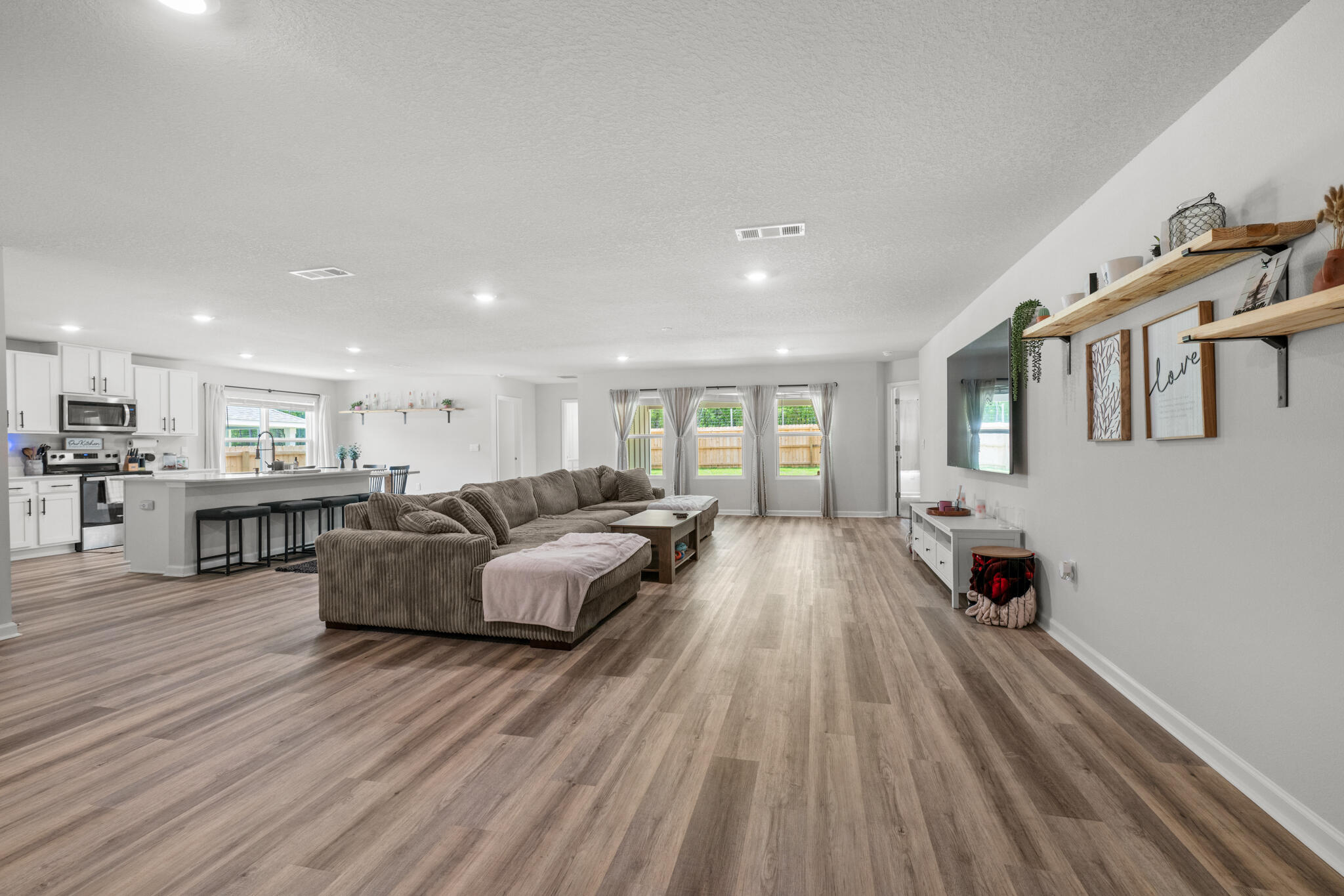 557 Mary Lou Way Crestview, FL 32539 - Photo 3 of 11 a living room with furniture and a wooden floor