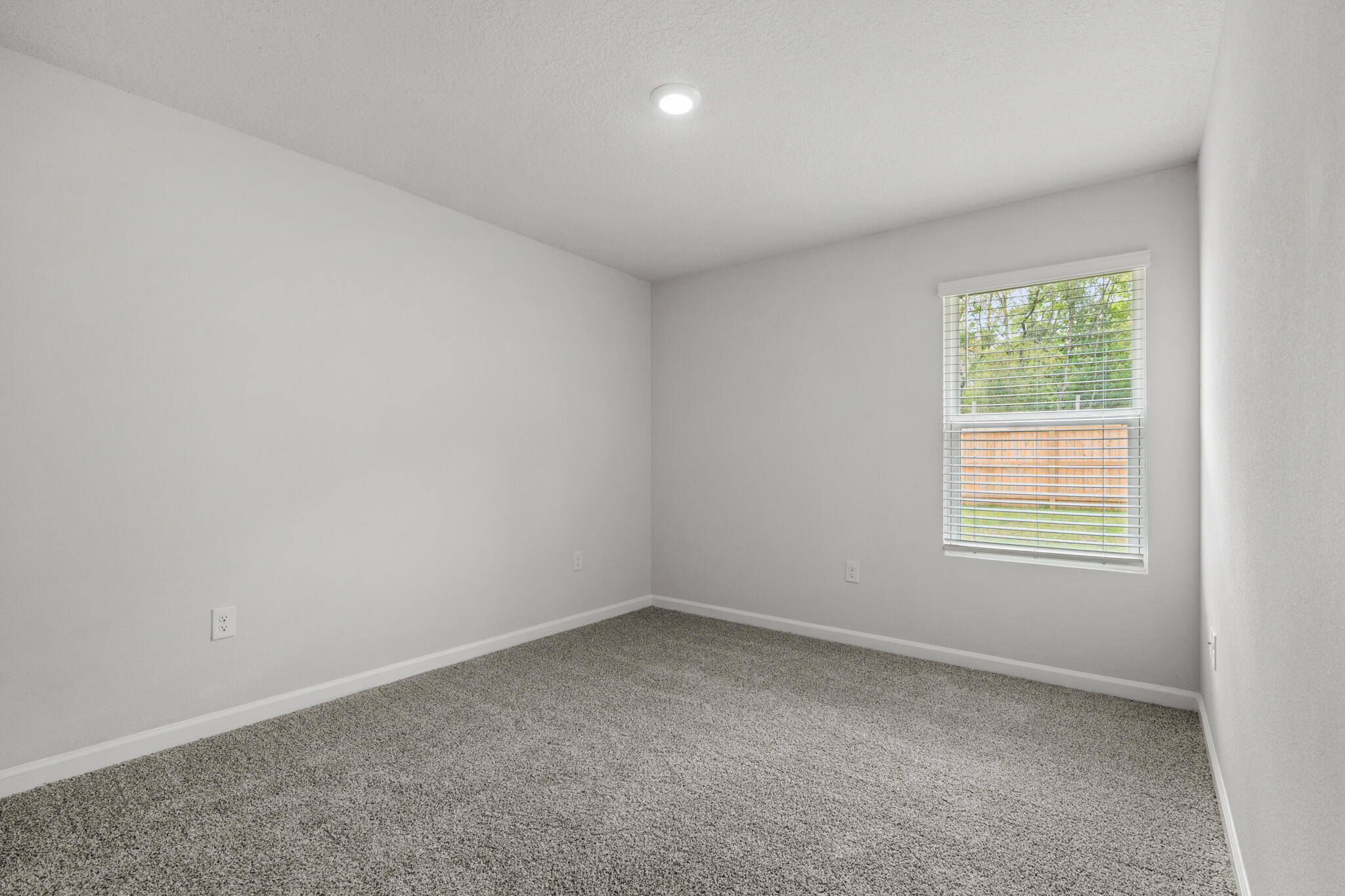 557 Mary Lou Way Crestview, FL 32539 - Photo 9 of 11 an empty room with a window