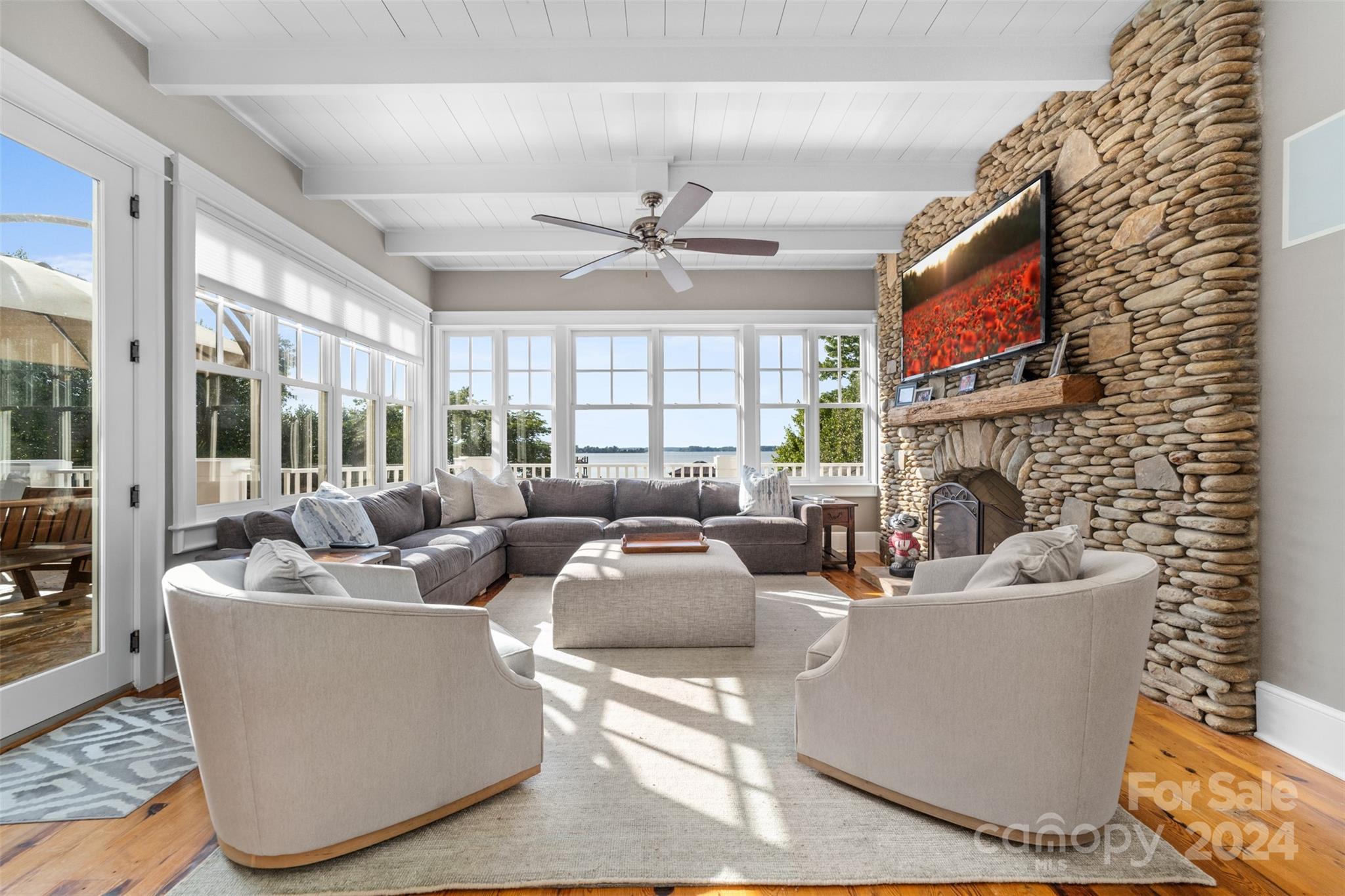 15515 Jetton Road Cornelius, NC 28031 - Photo 15 of 48 a living room with fireplace furniture and a large window