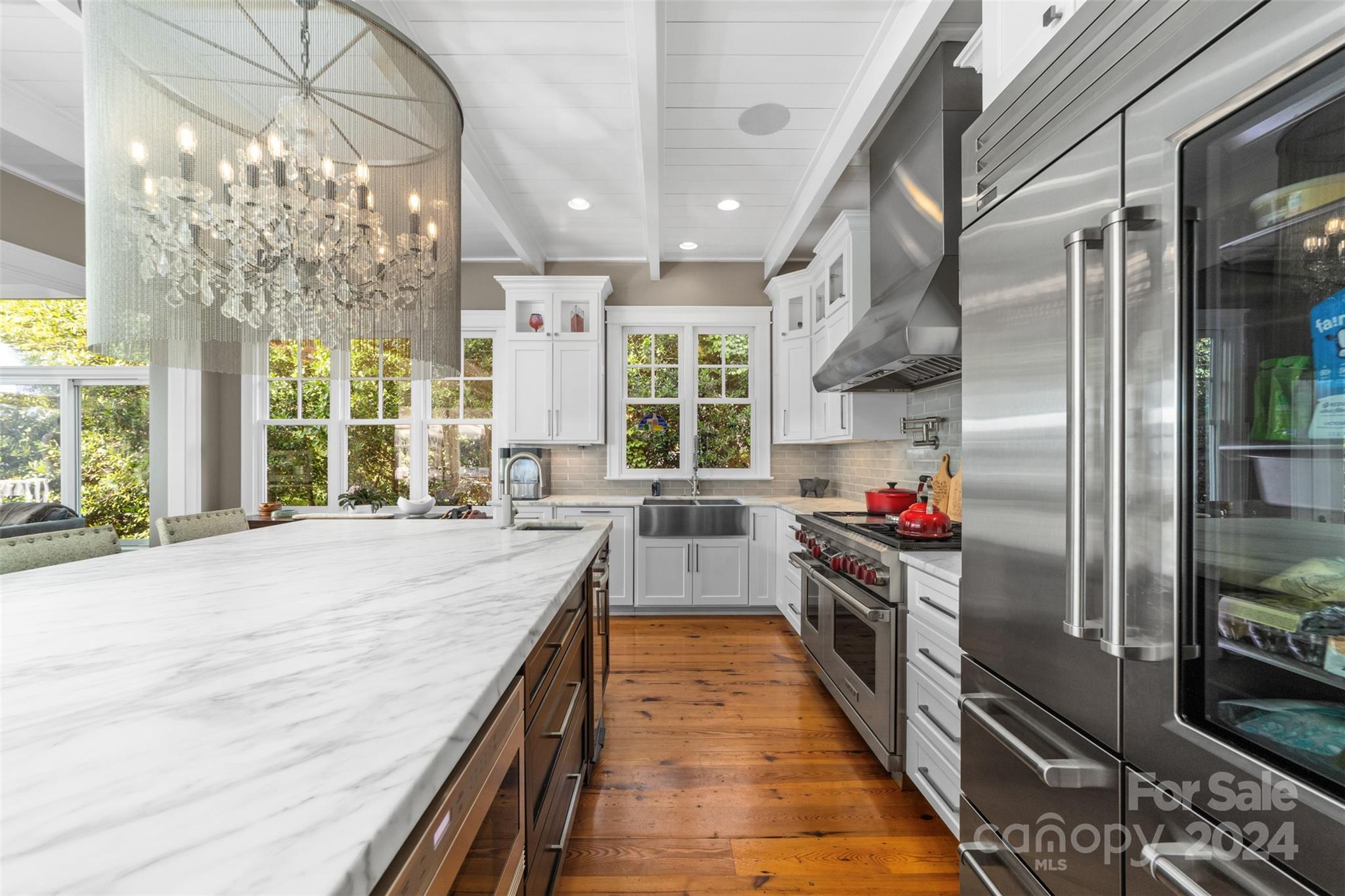 15515 Jetton Road Cornelius, NC 28031 - Photo 18 of 48 a kitchen with refrigerator a stove and a wooden floors