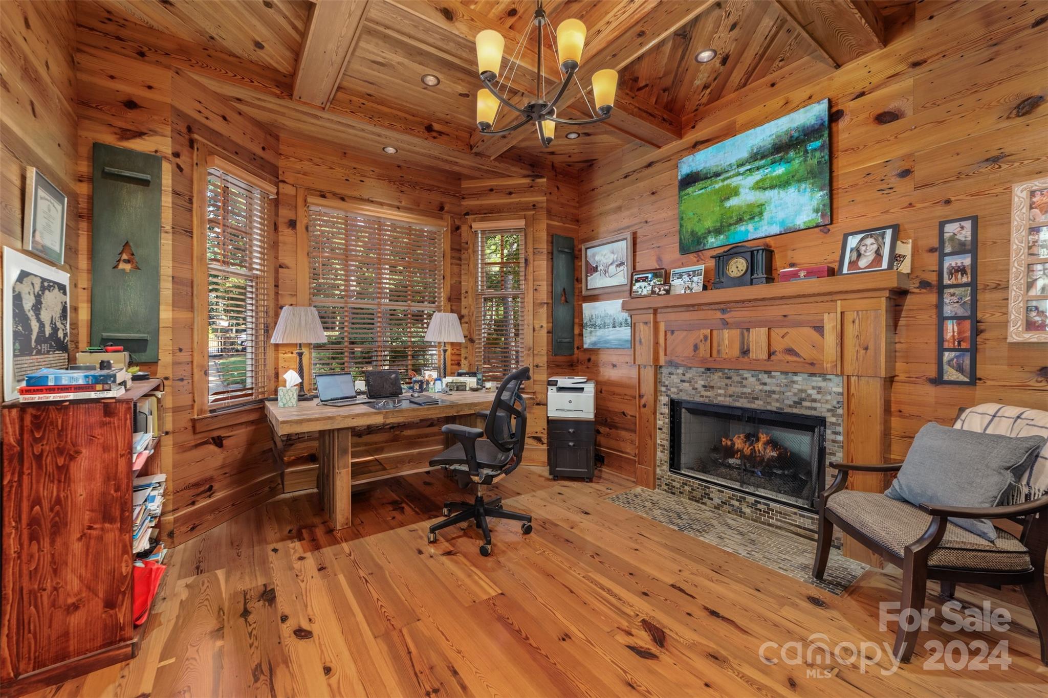 15515 Jetton Road Cornelius, NC 28031 - Photo 21 of 48 a living room with furniture a fireplace and a table