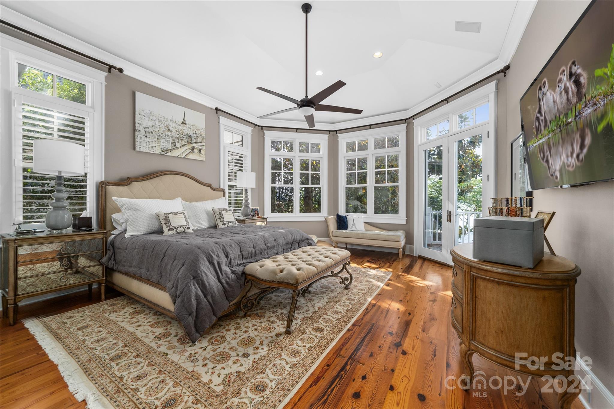 15515 Jetton Road Cornelius, NC 28031 - Photo 22 of 48 a bedroom with a large bed and a flat tv screen