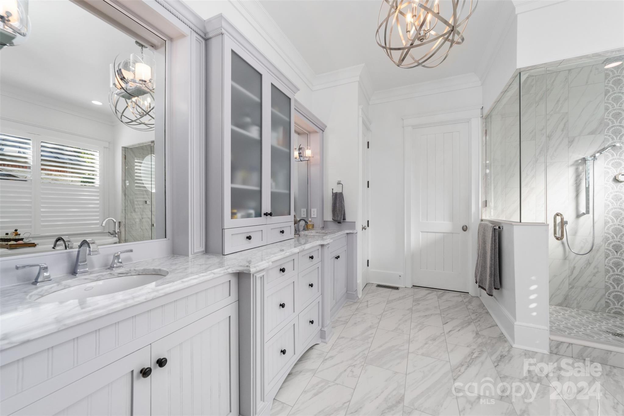 15515 Jetton Road Cornelius, NC 28031 - Photo 23 of 48 a spacious bathroom with a double vanity sink a mirror and a shower