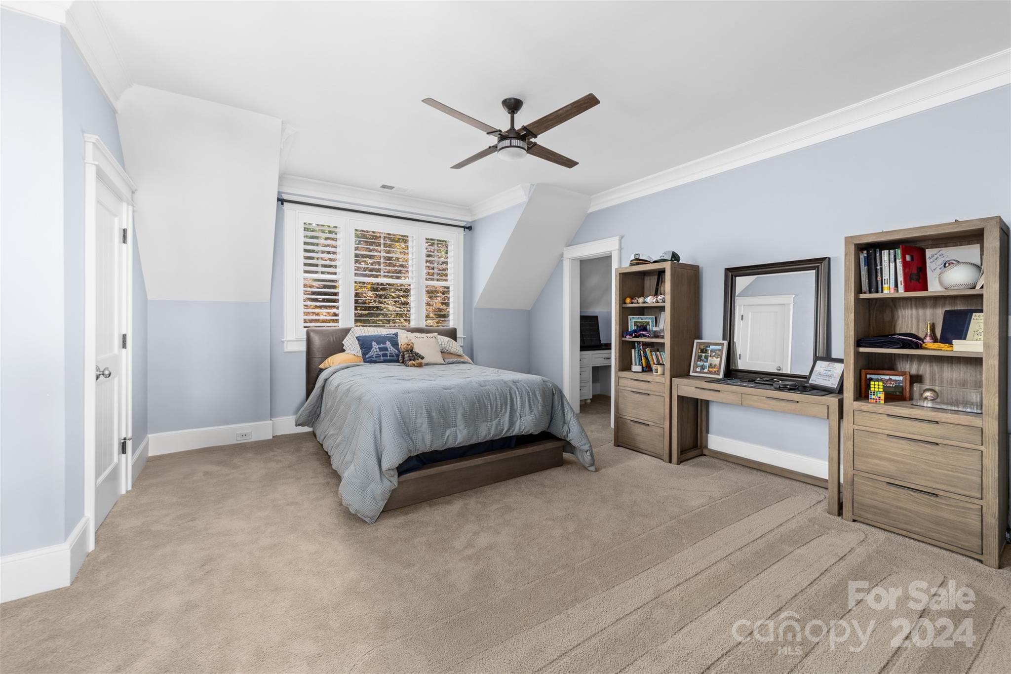 15515 Jetton Road Cornelius, NC 28031 - Photo 28 of 48 a bedroom with a large bed and a chandelier