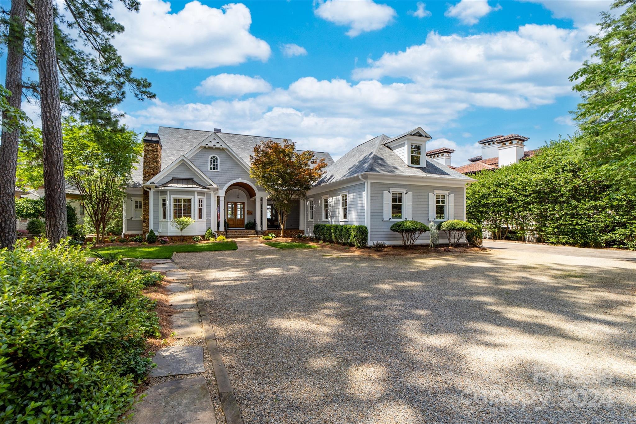 15515 Jetton Road Cornelius, NC 28031 - Photo 3 of 48 a front view of a house with a garden