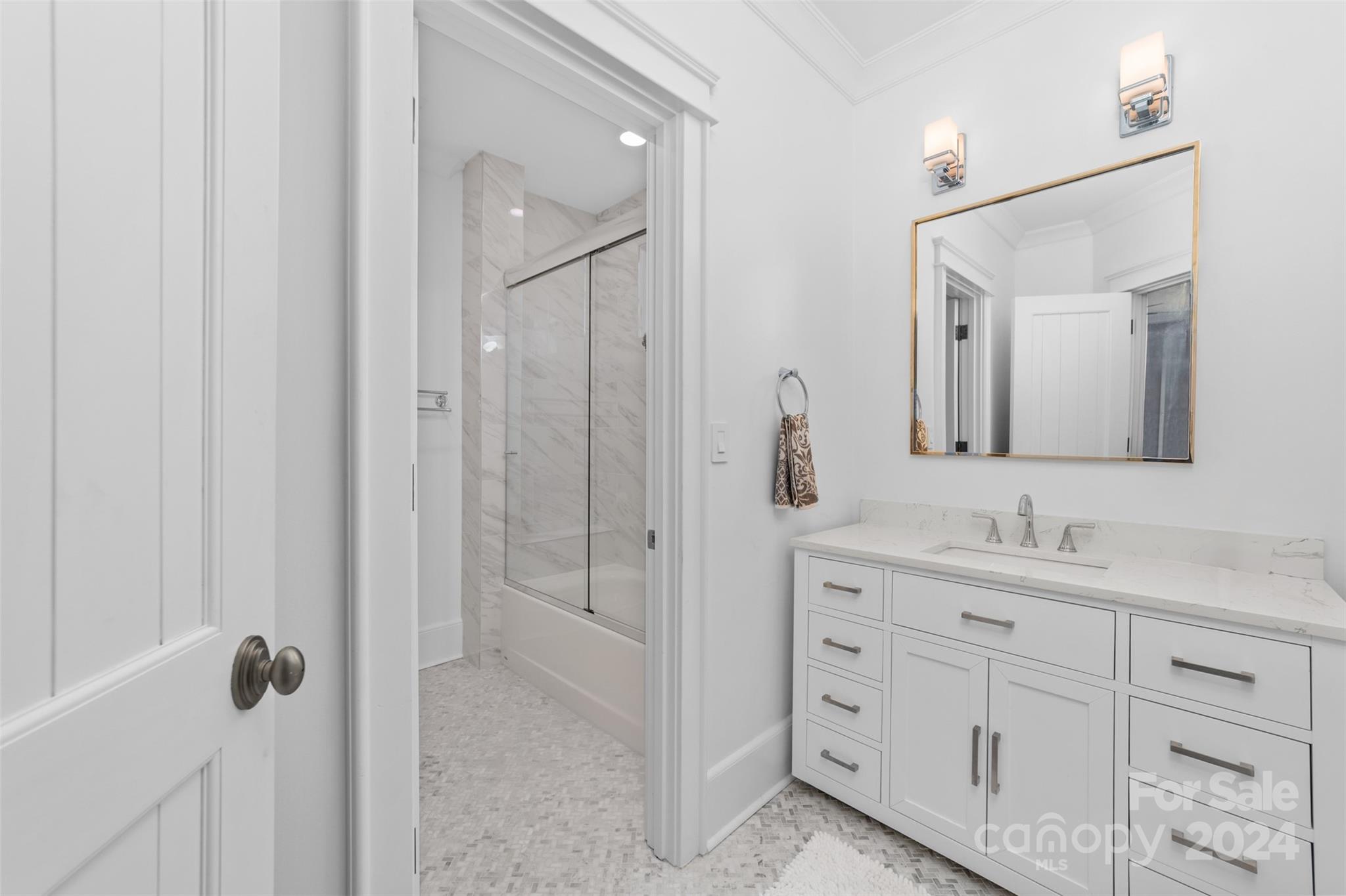 15515 Jetton Road Cornelius, NC 28031 - Photo 31 of 48 a bathroom with a double vanity sink and mirror