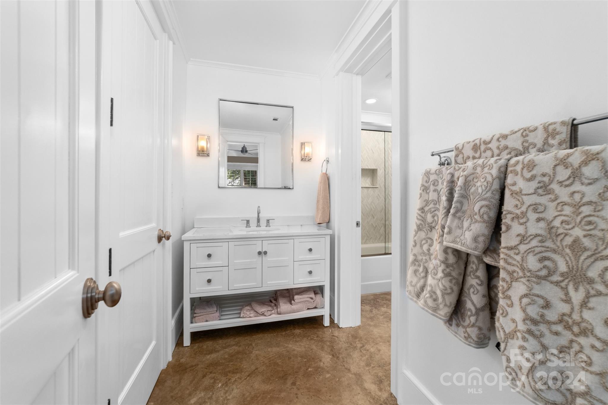 15515 Jetton Road Cornelius, NC 28031 - Photo 33 of 48 a bathroom with a bathtub sink and mirror