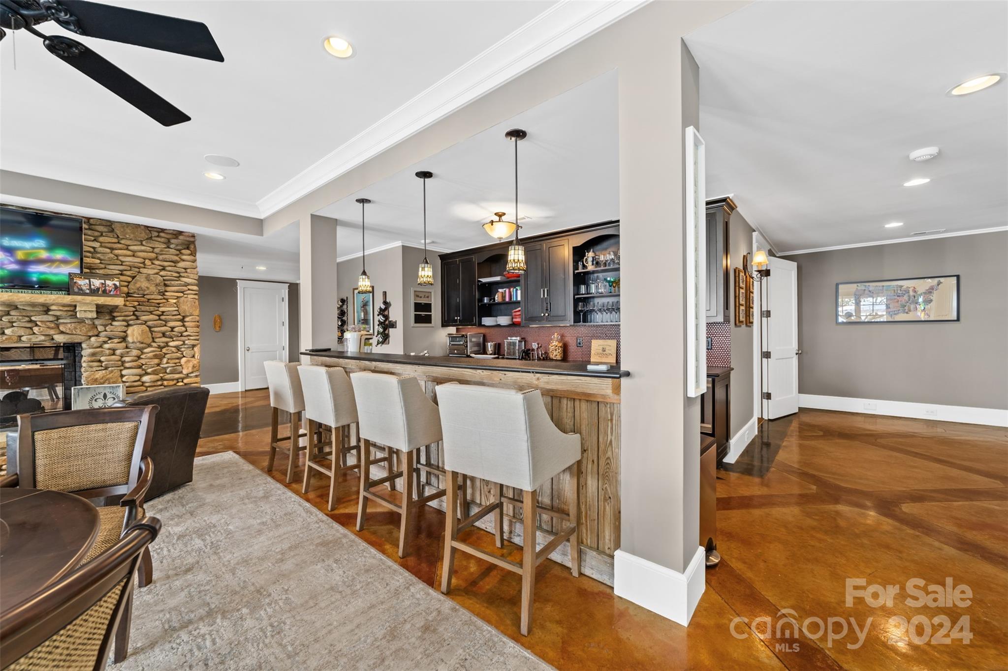 15515 Jetton Road Cornelius, NC 28031 - Photo 35 of 48 a kitchen with stainless steel appliances kitchen island granite countertop a refrigerator and microwave