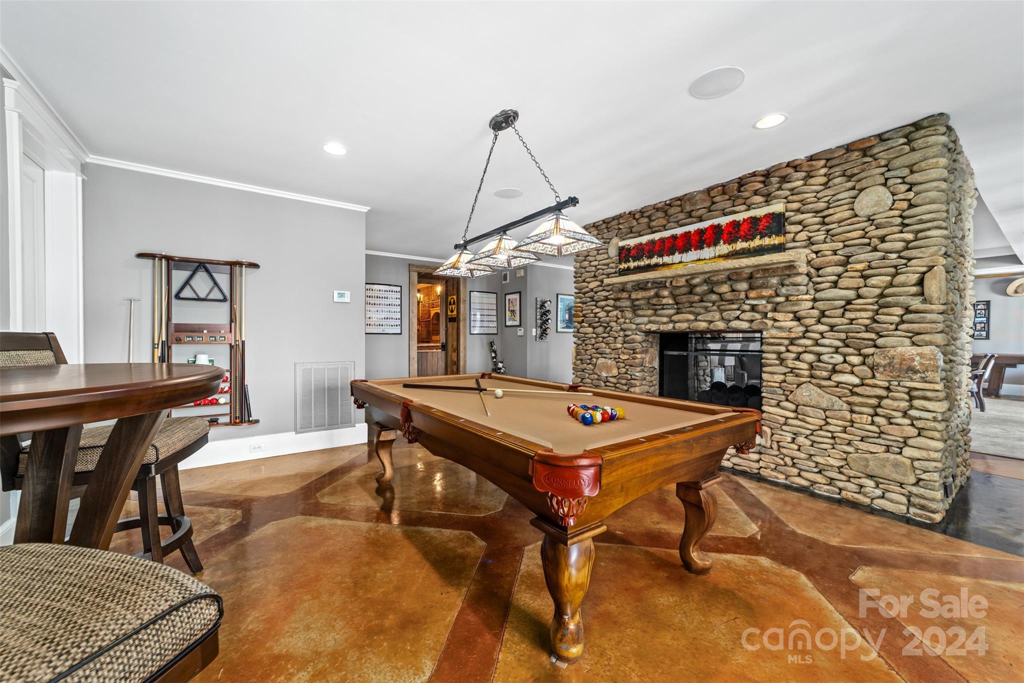15515 Jetton Road Cornelius, NC 28031 - Photo 37 of 48 a living room with a table chairs and a fireplace