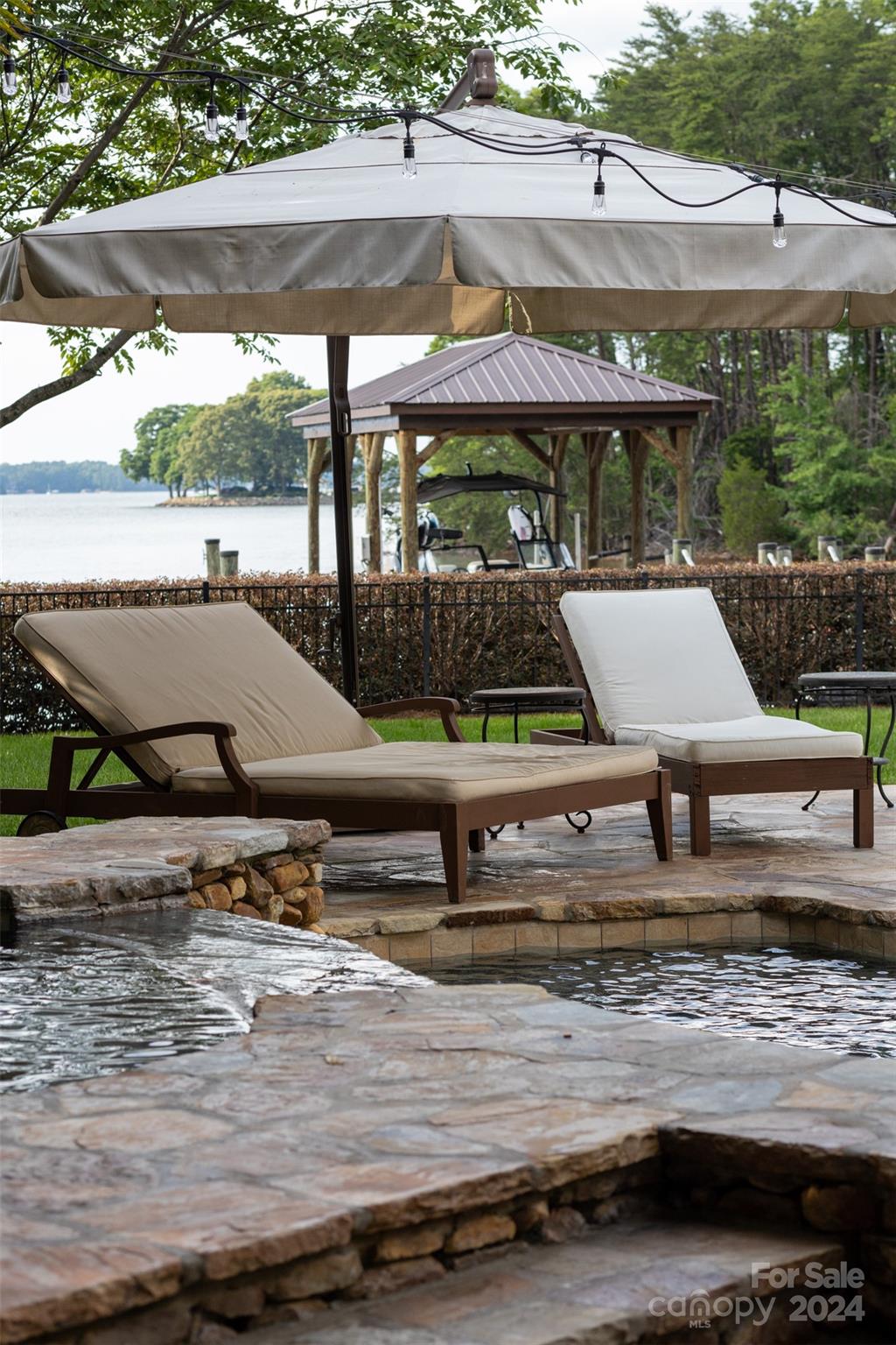 15515 Jetton Road Cornelius, NC 28031 - Photo 40 of 48 a view of a swimming pool with a patio