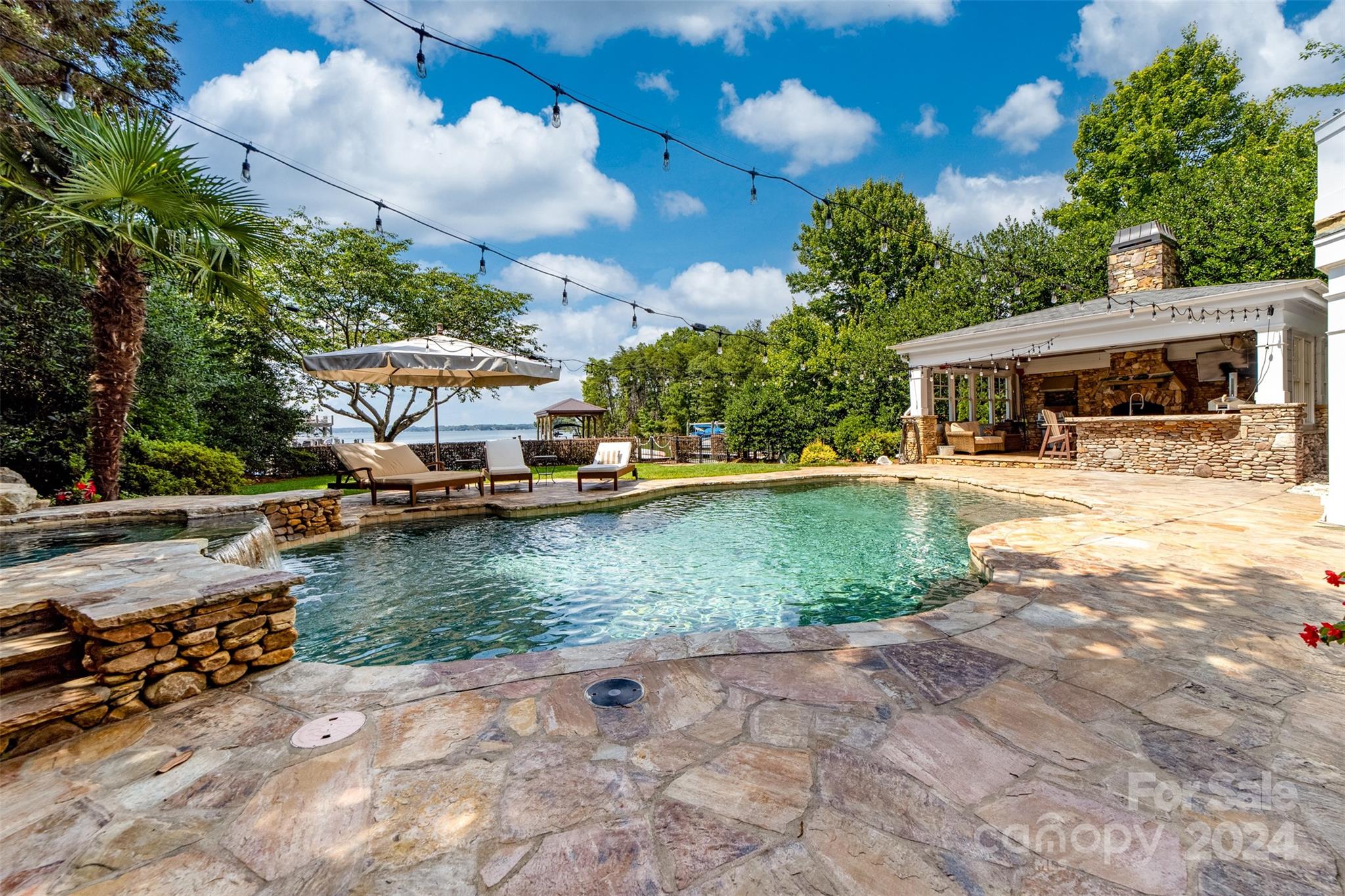 15515 Jetton Road Cornelius, NC 28031 - Photo 41 of 48 a view of a house with swimming pool and sitting area