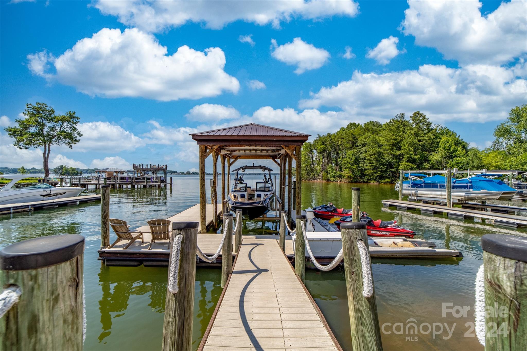 15515 Jetton Road Cornelius, NC 28031 - Photo 8 of 48 a view of a lake with couches chairs