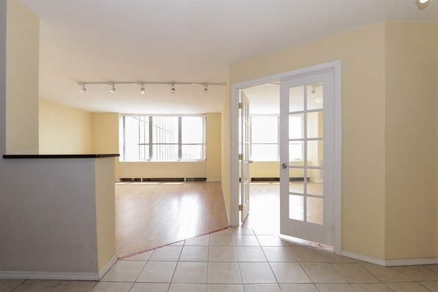 655 West Irving Park Road, Unit 5311 Chicago, IL 60613 - Photo 6 of 10 a view of an empty room and window