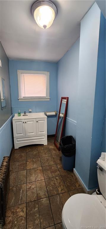 60 Jay Street New London, CT 06320 - Photo 17 of 17 a bathroom with a sink a toilet and a mirror