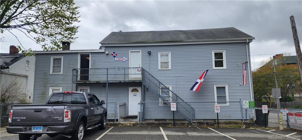 60 Jay Street New London, CT 06320 - Photo 2 of 17 a front view of a house with parking space