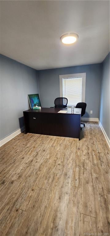 60 Jay Street New London, CT 06320 - Photo 9 of 17 a bedroom with a bed and a night stand