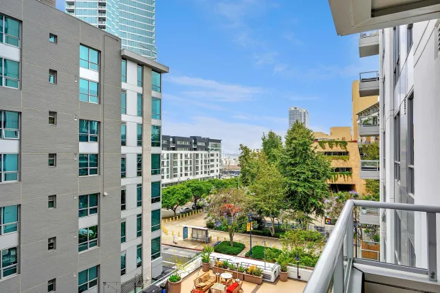 a view of tall building sitting on the side of a street