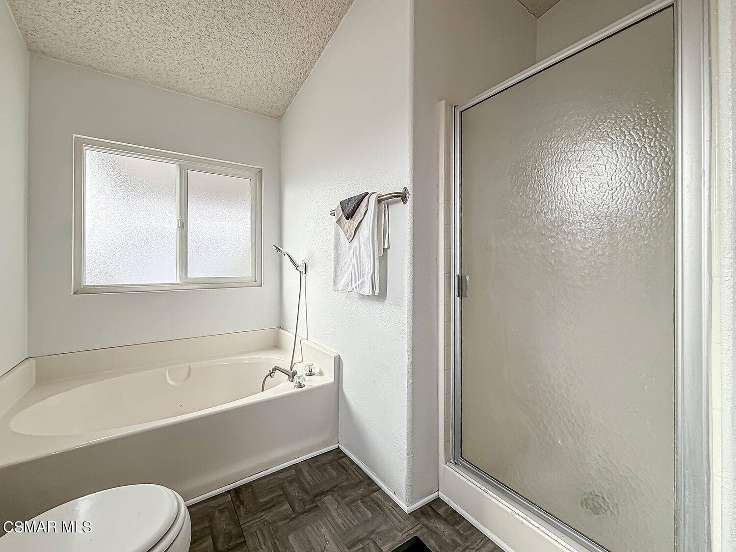 250 East Telegraph Road, Unit 248 Fillmore, CA 93015 - Photo 18 of 42 a bathroom with a bathtub toilet and shower