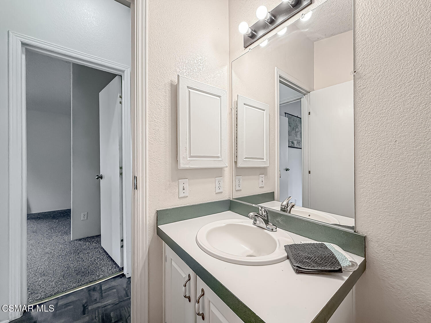 250 East Telegraph Road, Unit 248 Fillmore, CA 93015 - Photo 21 of 42 a bathroom with a sink and a mirror