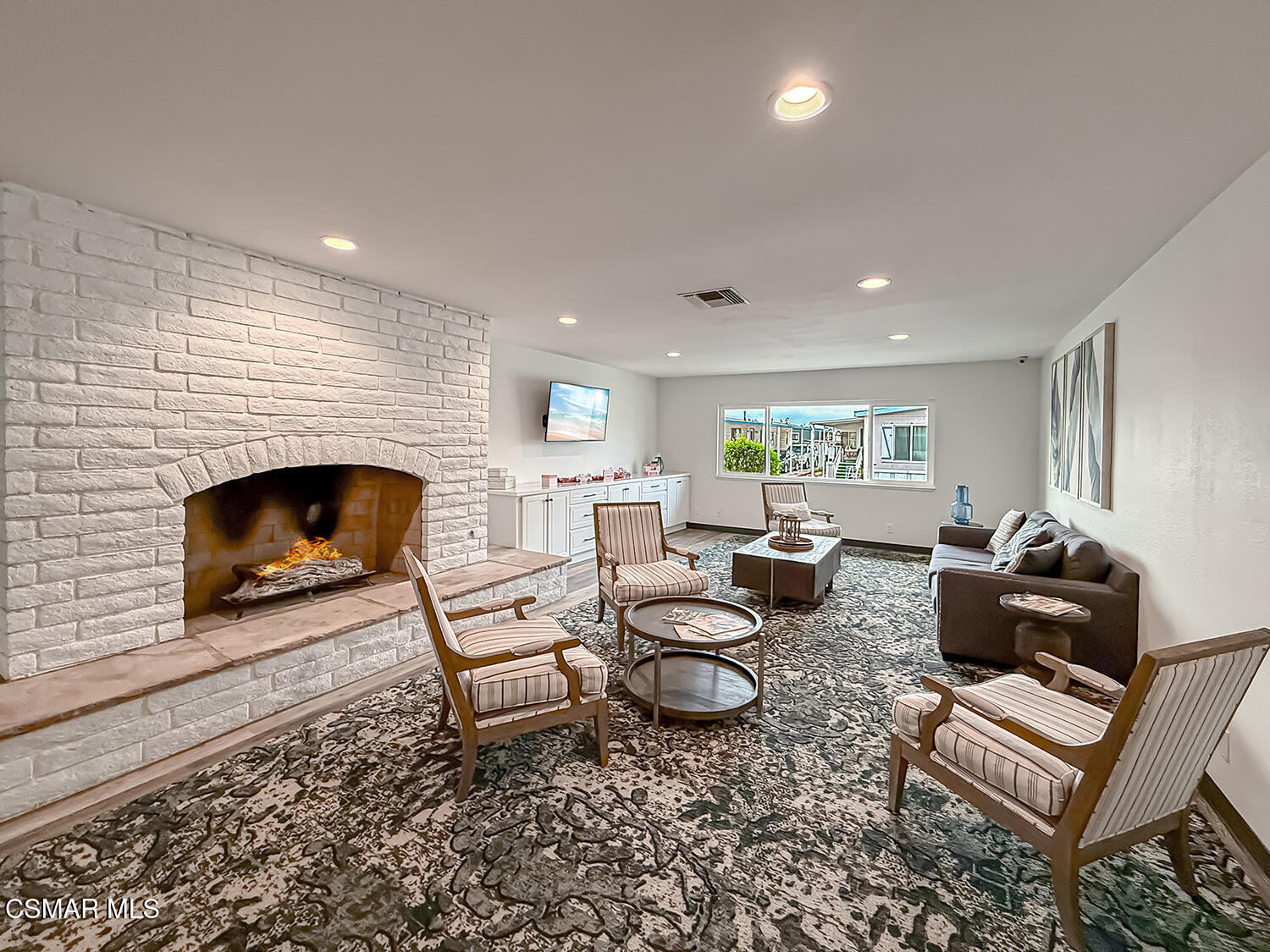 250 East Telegraph Road, Unit 248 Fillmore, CA 93015 - Photo 34 of 42 a living room with furniture and a fireplace