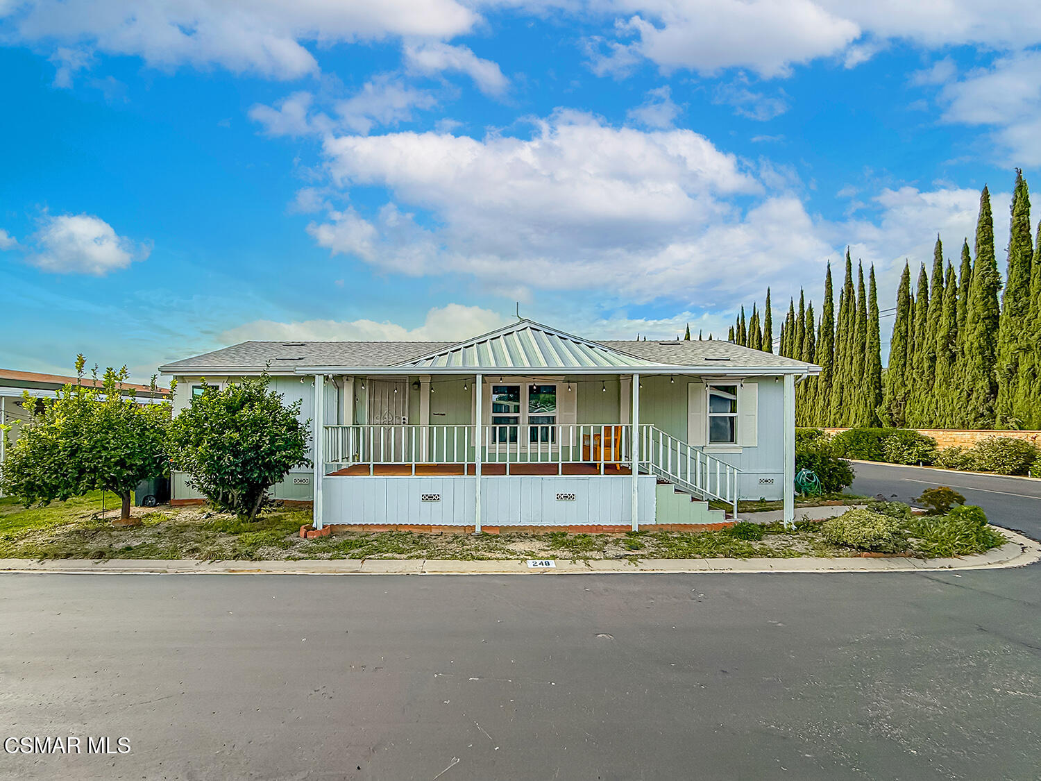 250 East Telegraph Road, Unit 248 Fillmore, CA 93015 - Photo 37 of 42 a front view of a house with a garden