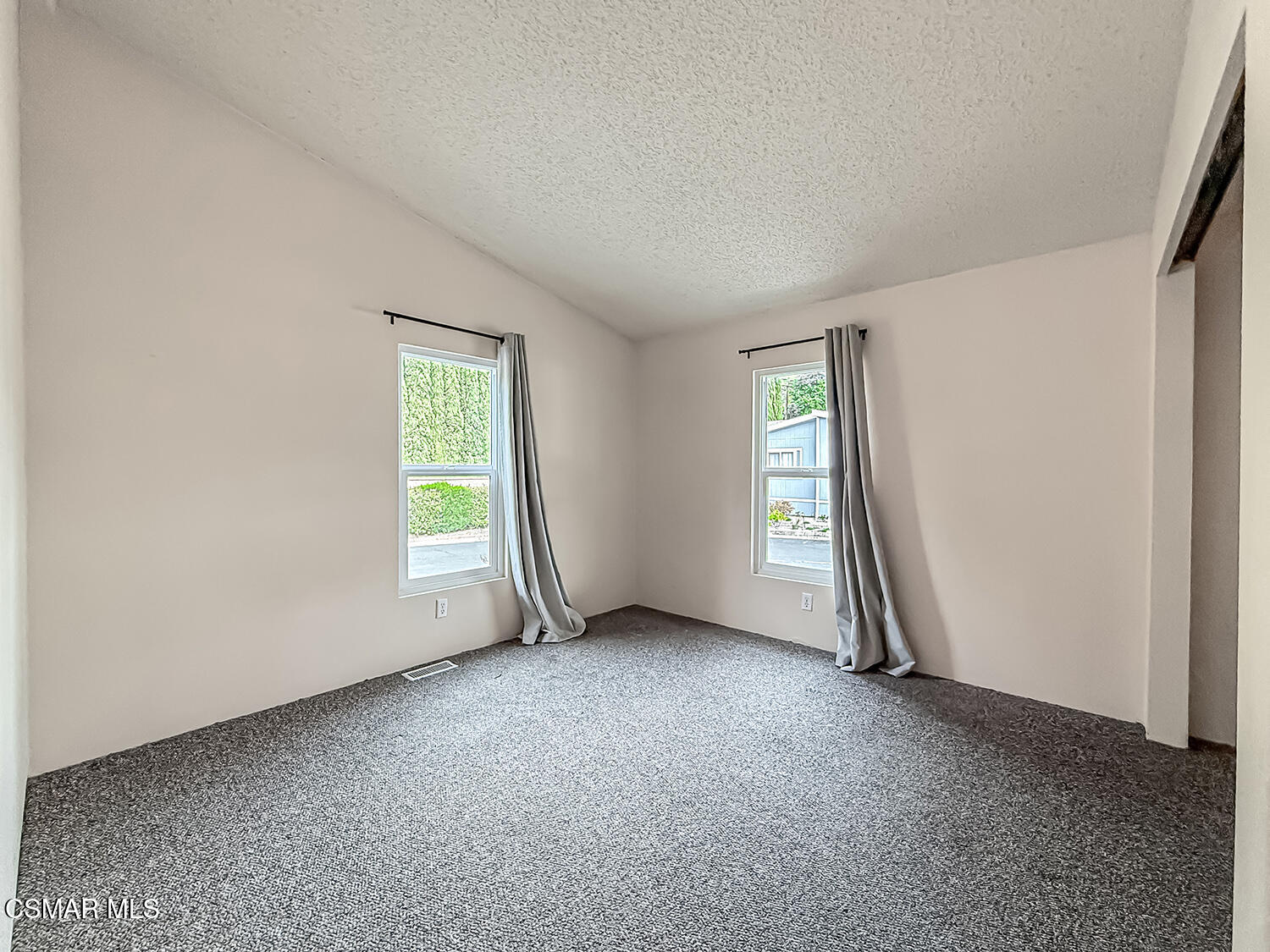 250 East Telegraph Road, Unit 248 Fillmore, CA 93015 - Photo 7 of 42 an empty room with windows