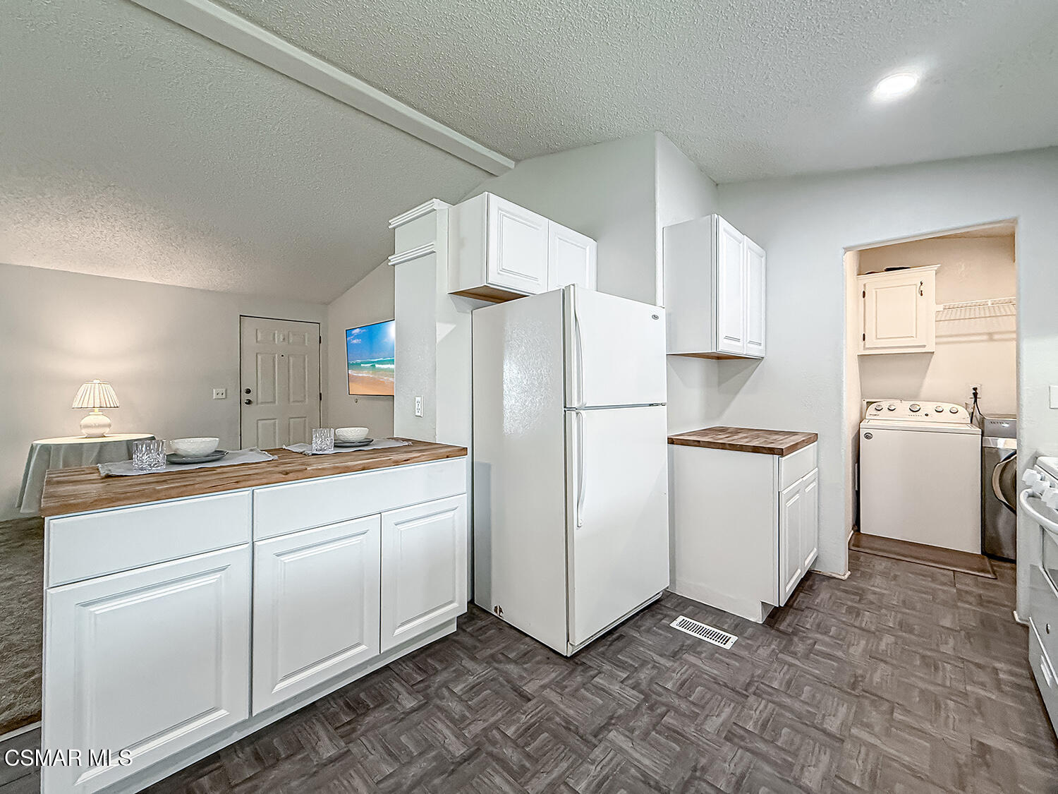 250 East Telegraph Road, Unit 248 Fillmore, CA 93015 - Photo 10 of 42 a kitchen with white cabinets and white appliances