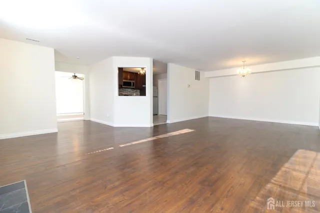 a view of a livingroom with wooden floor