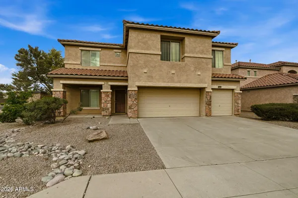 a front view of a house with parking space