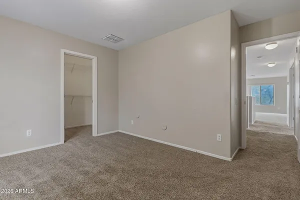 an empty room with closet area