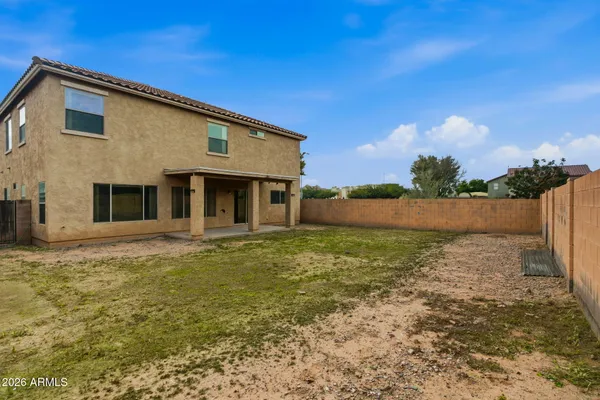 a view of front door and yard