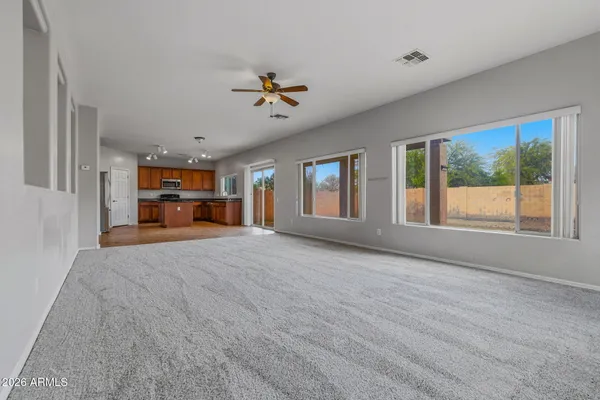 a view of a livingroom with furniture and a window