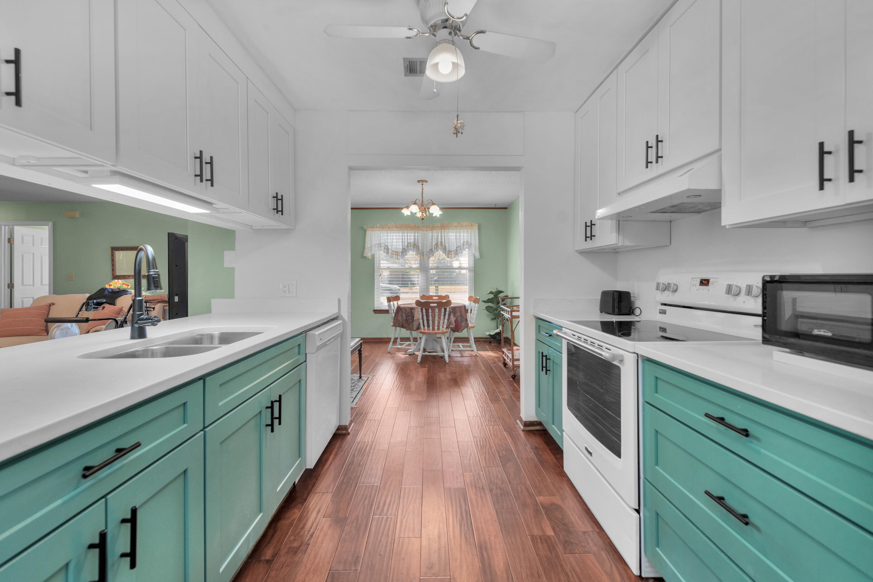 371 Echo Circle Fort Walton Beach, FL 32548 - Photo 11 of 36 a kitchen with kitchen island granite countertop lots of counter top space and stainless steel appliances