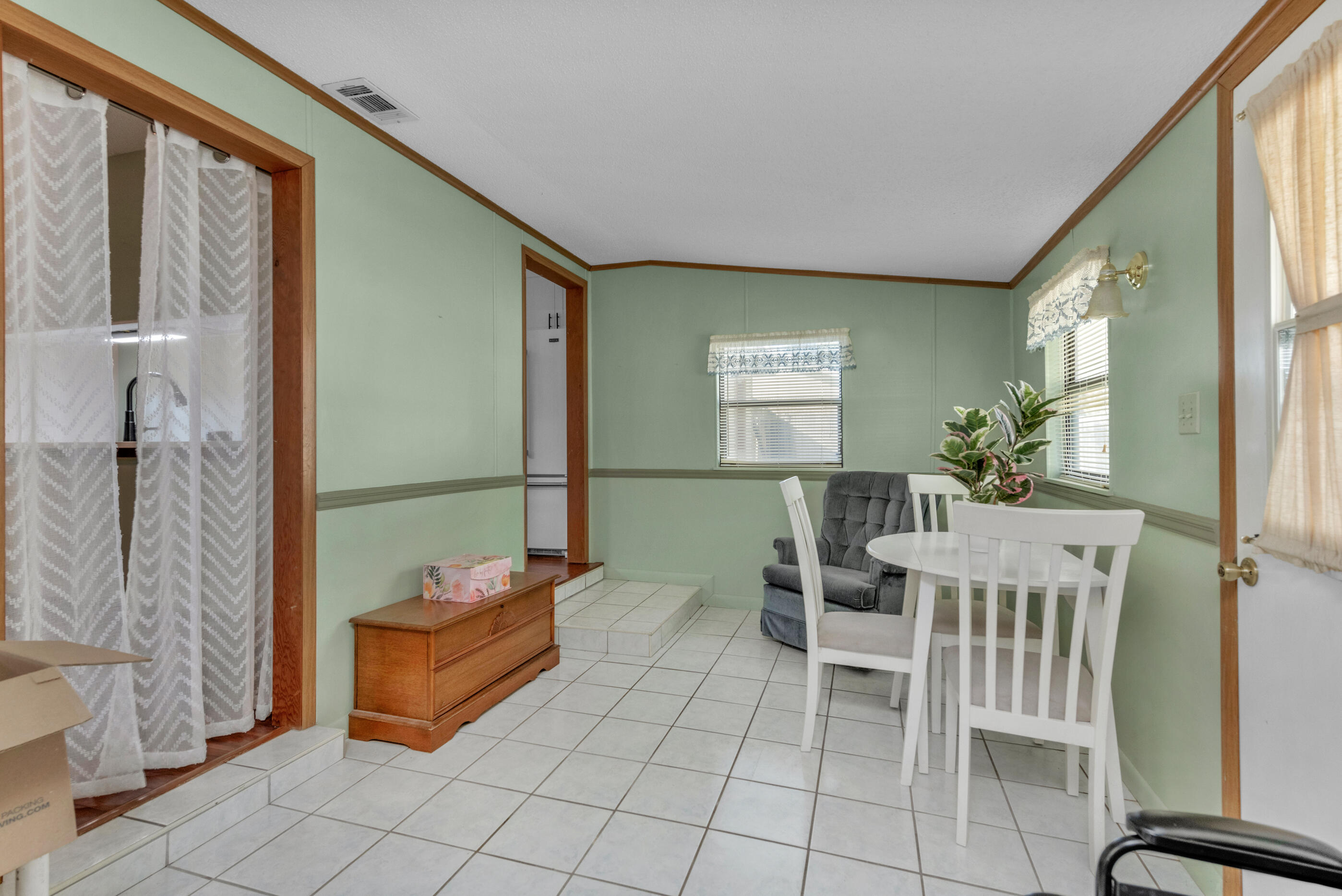 371 Echo Circle Fort Walton Beach, FL 32548 - Photo 13 of 36 a dining room with furniture and a window