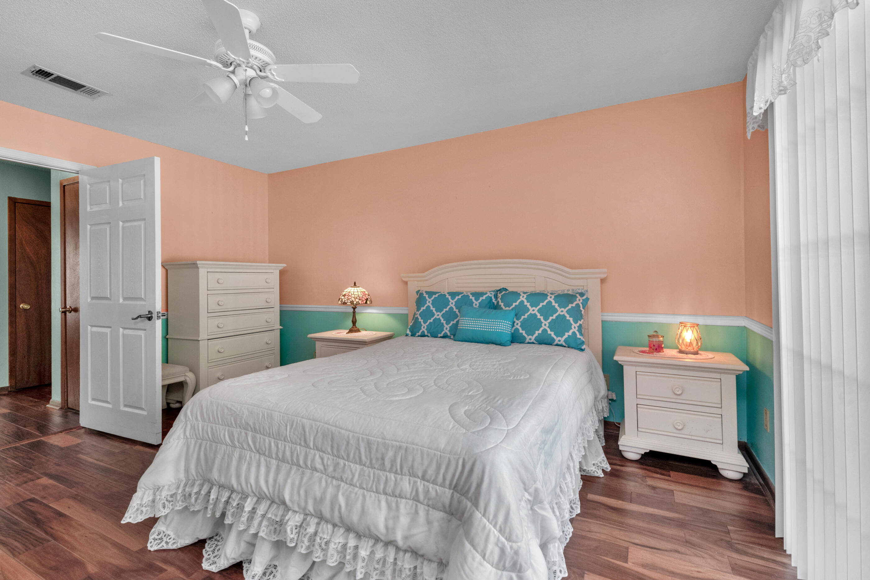 371 Echo Circle Fort Walton Beach, FL 32548 - Photo 14 of 36 a bedroom with a bed dresser and a window