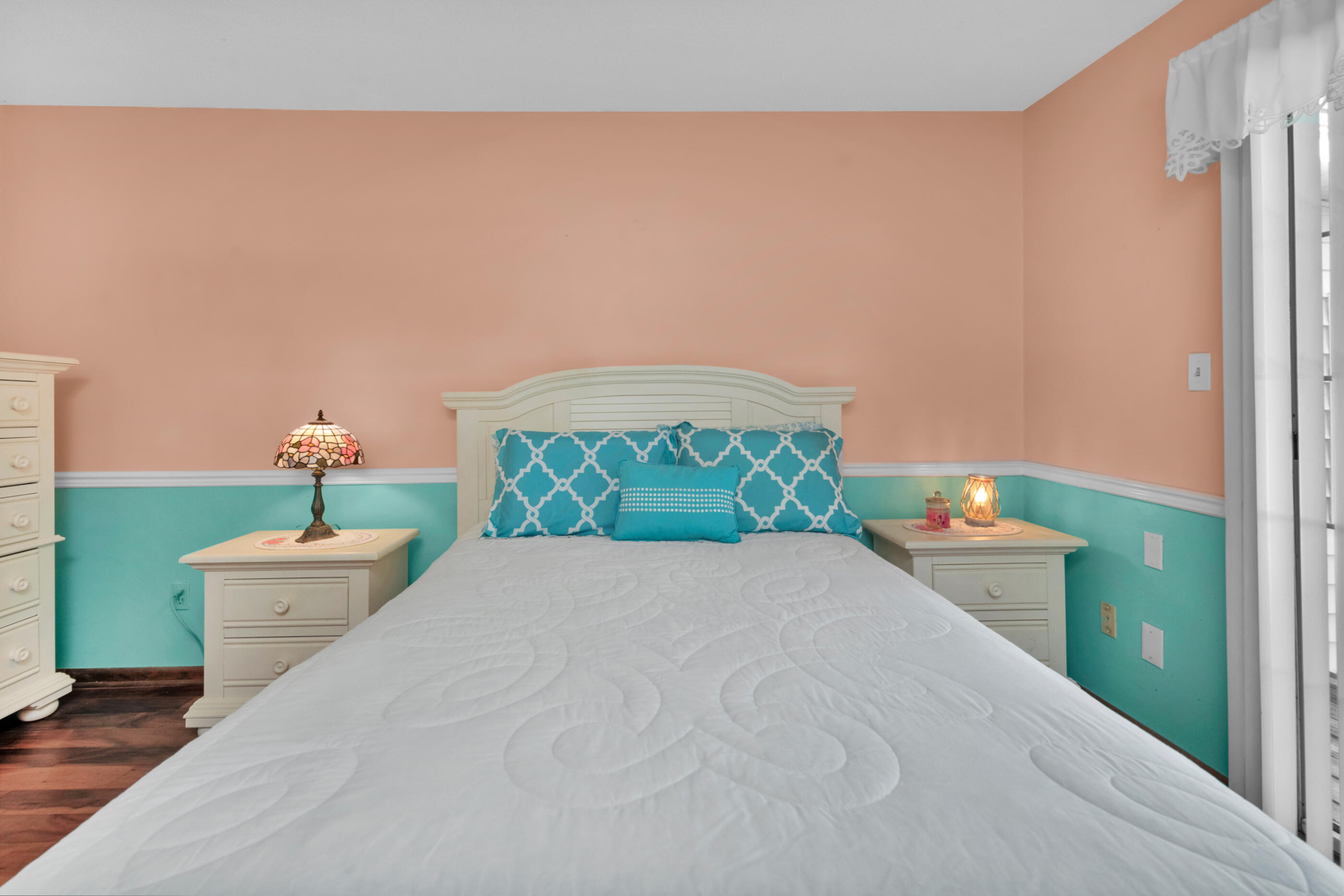 371 Echo Circle Fort Walton Beach, FL 32548 - Photo 15 of 36 a bed room with a bed and a painting on the wall