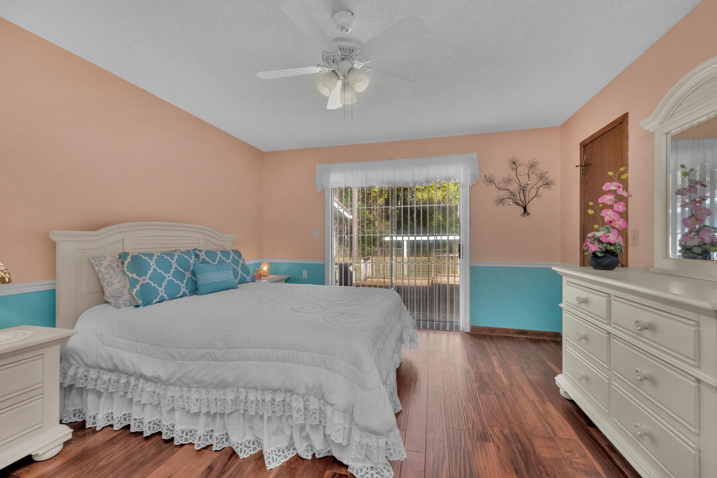 371 Echo Circle Fort Walton Beach, FL 32548 - Photo 17 of 36 a large bed sitting in a bedroom next to a window