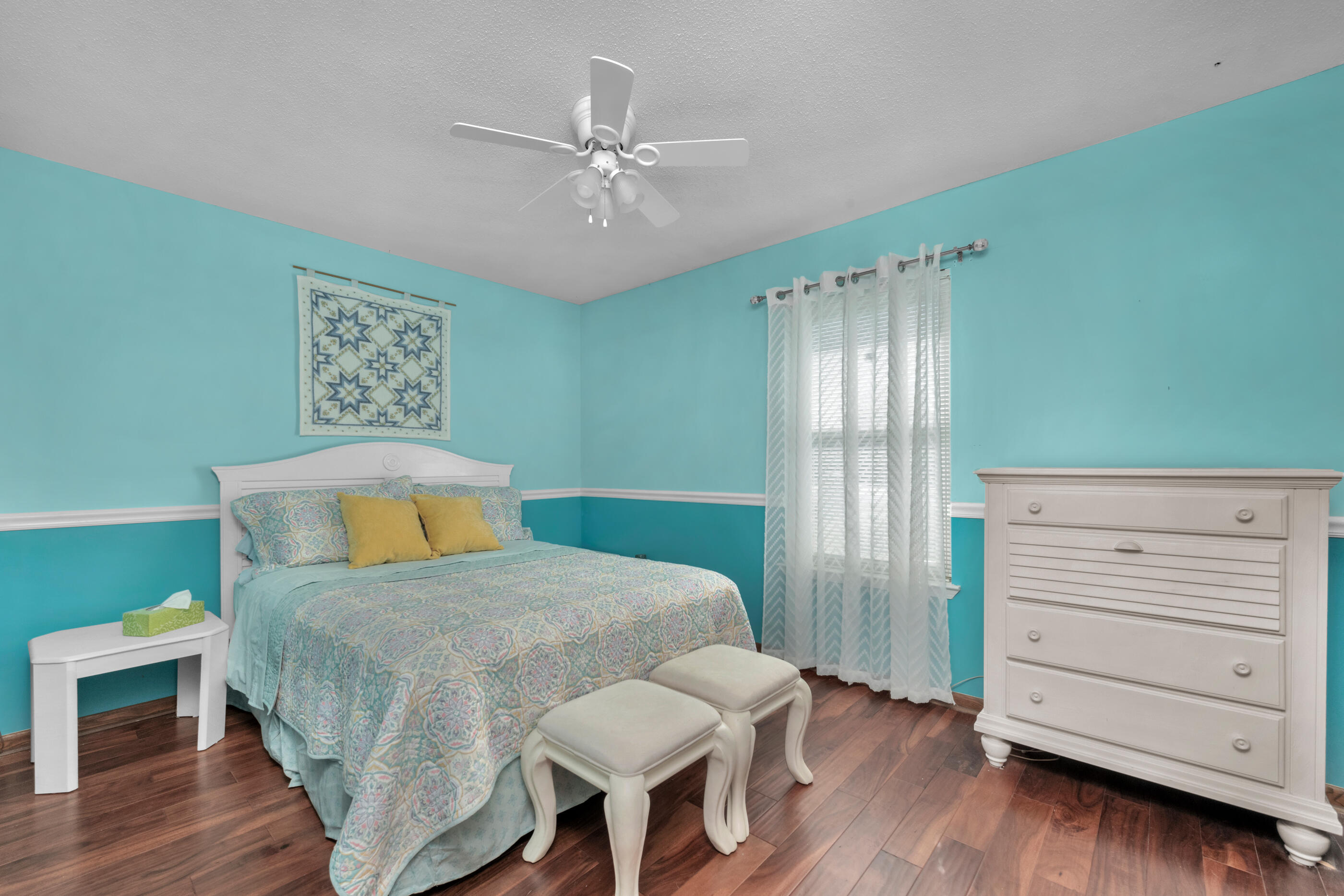 371 Echo Circle Fort Walton Beach, FL 32548 - Photo 21 of 36 a bedroom with a bed and furniture