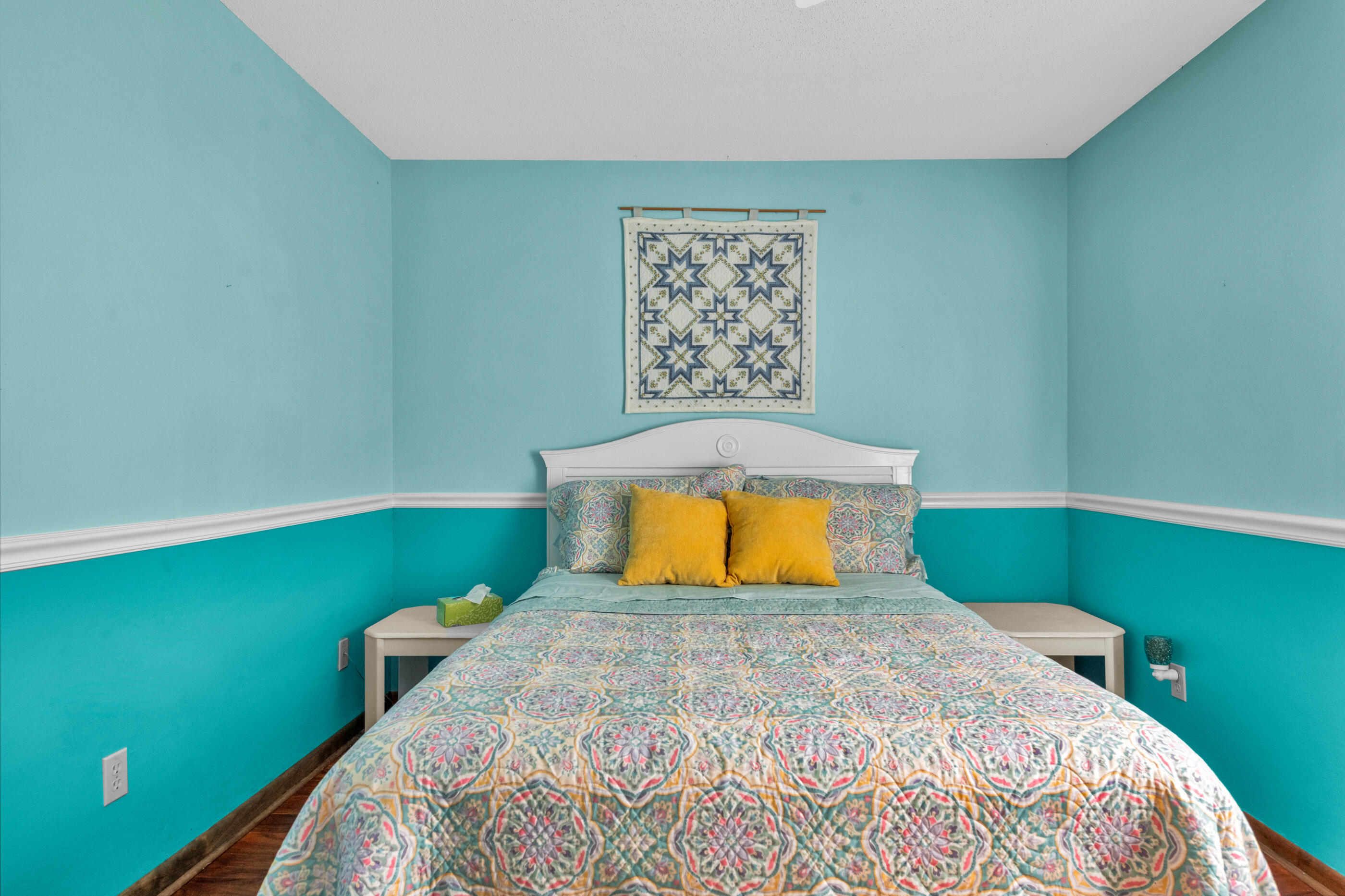 371 Echo Circle Fort Walton Beach, FL 32548 - Photo 22 of 36 a bedroom with a bed and a wall painting