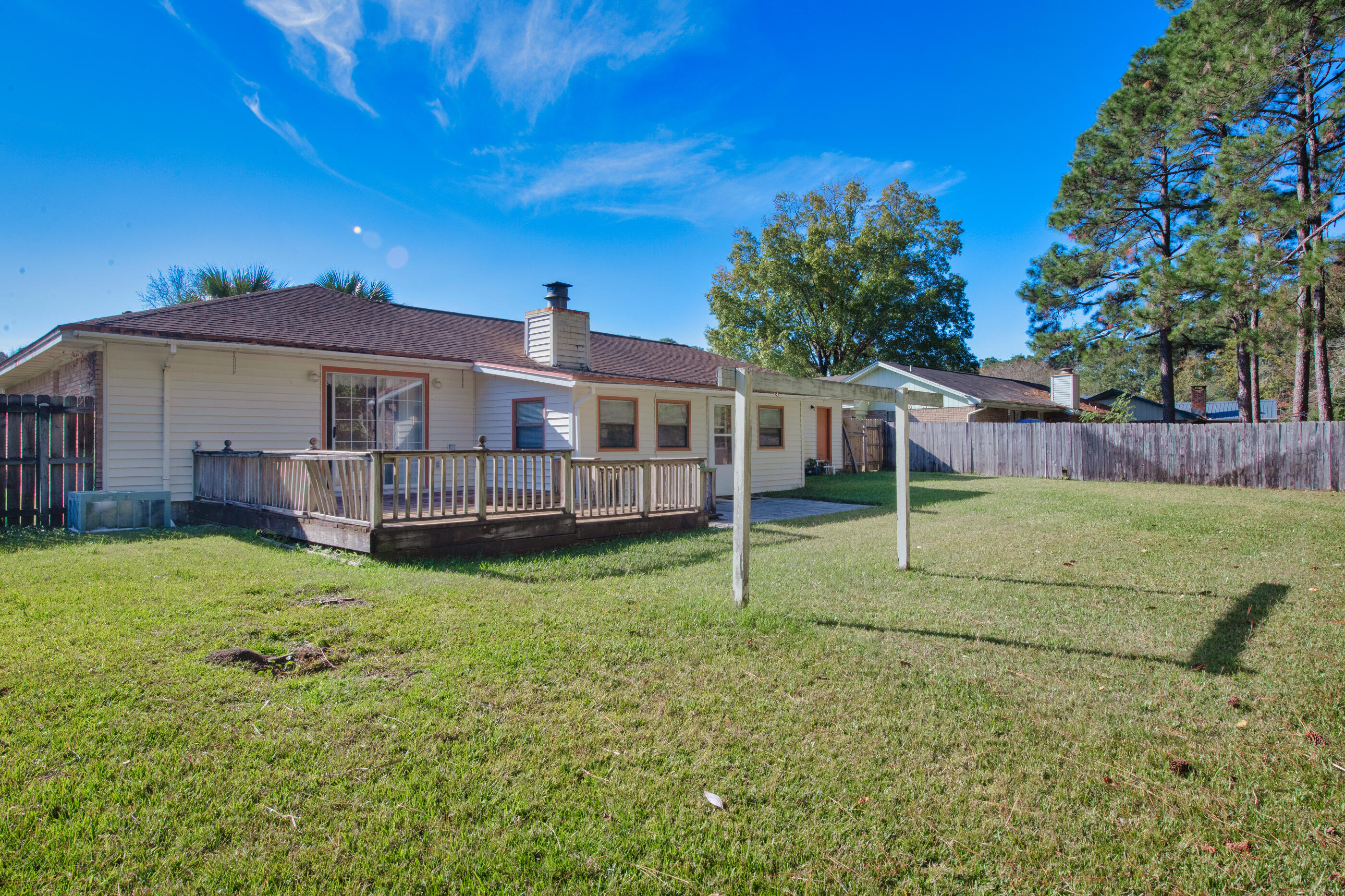 371 Echo Circle Fort Walton Beach, FL 32548 - Photo 25 of 36 a view of a house with a backyard and a tree