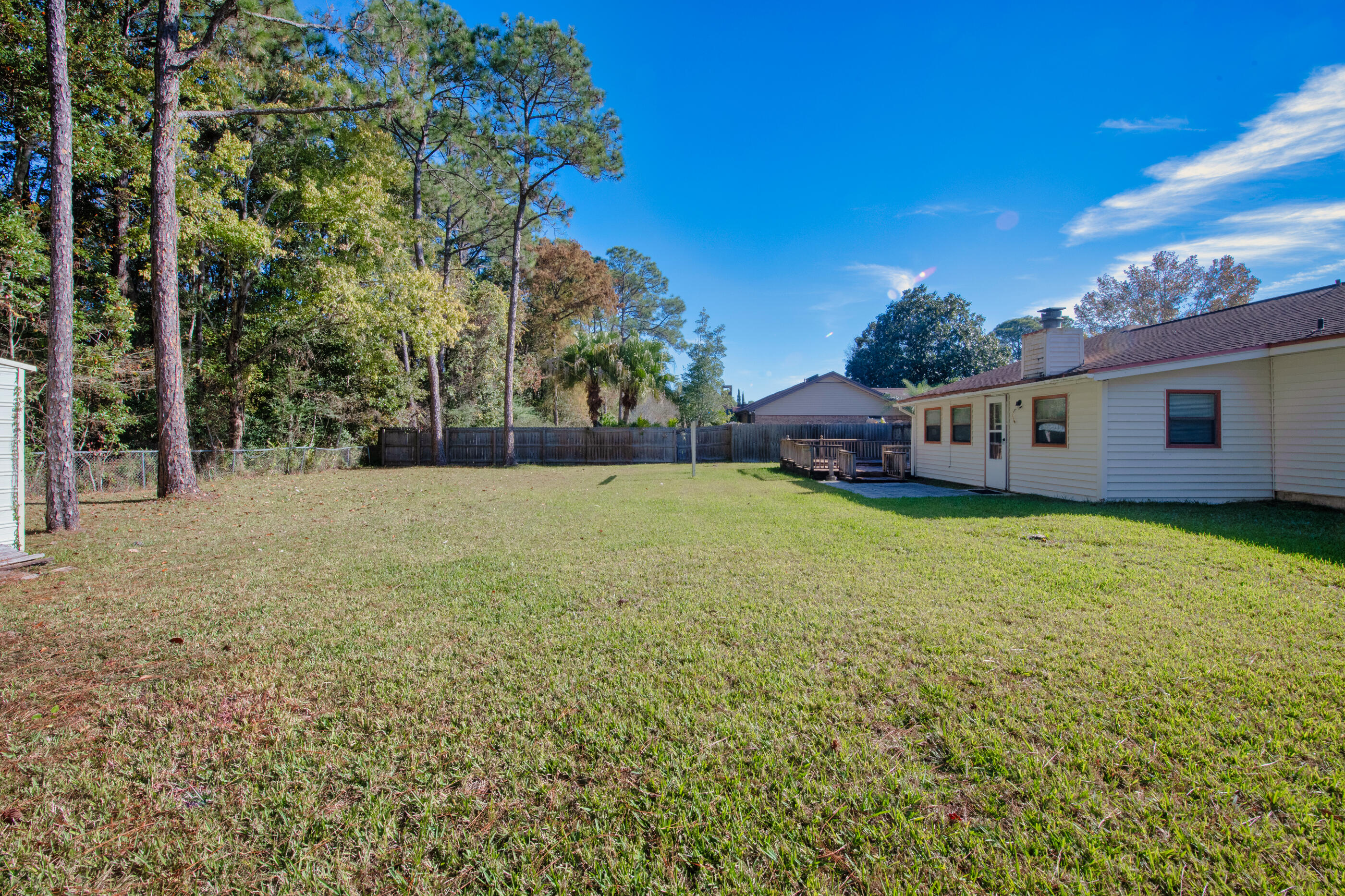 371 Echo Circle Fort Walton Beach, FL 32548 - Photo 30 of 36 a view of a house with a backyard