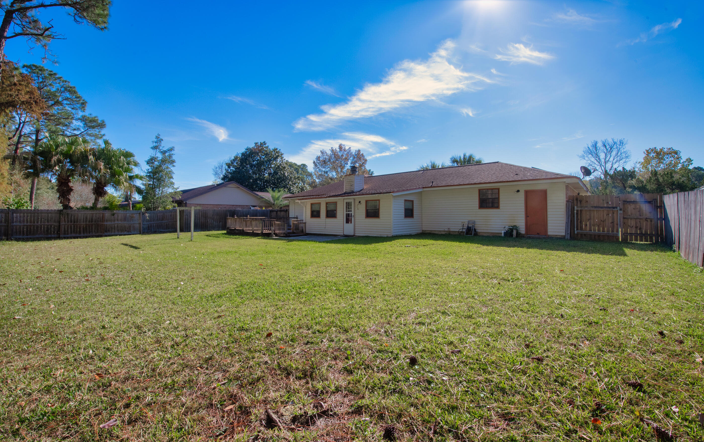 371 Echo Circle Fort Walton Beach, FL 32548 - Photo 31 of 36 a view of a house with a garden and yard