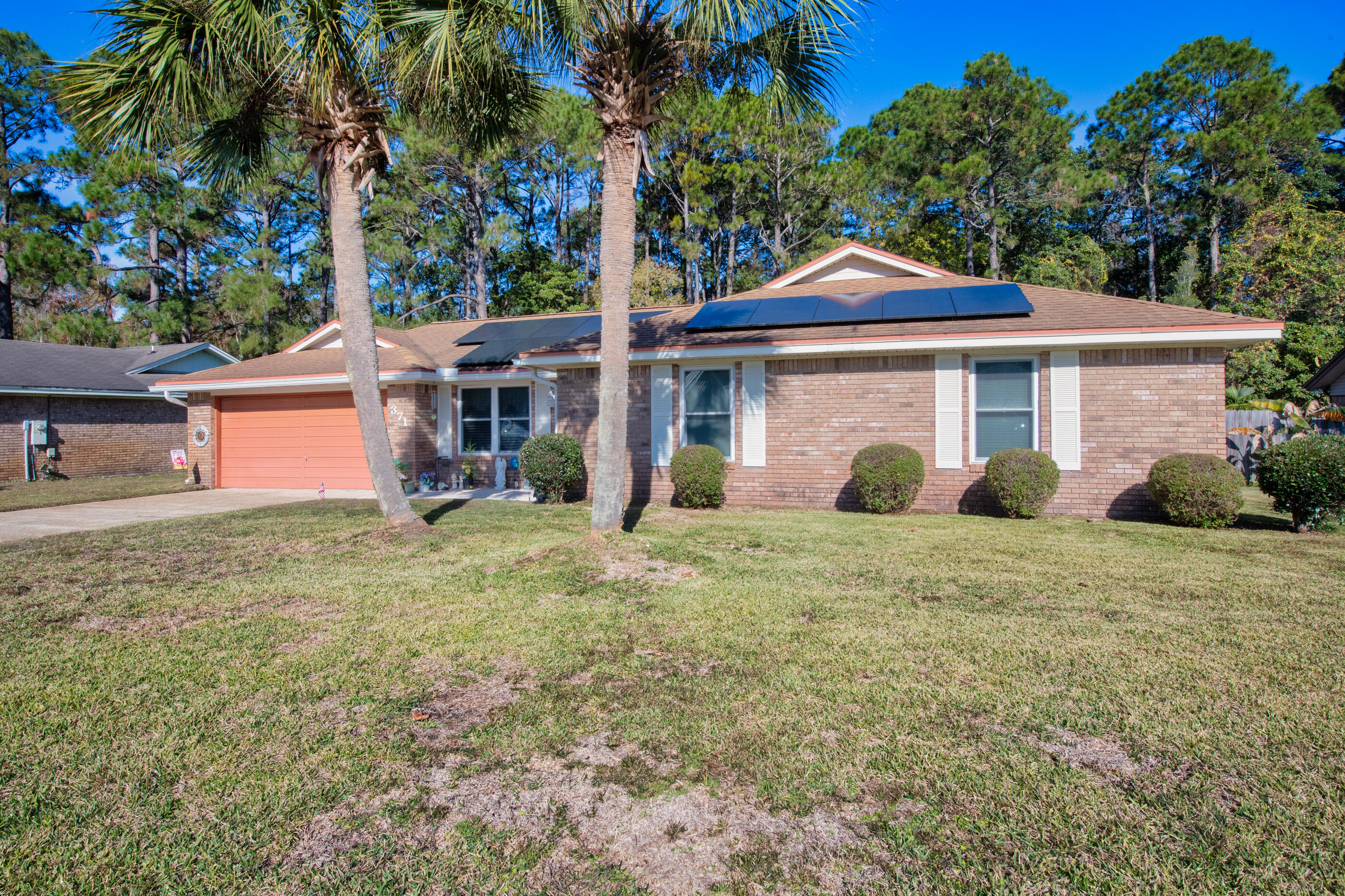 371 Echo Circle Fort Walton Beach, FL 32548 - Photo 35 of 36 a front view of a house with garden