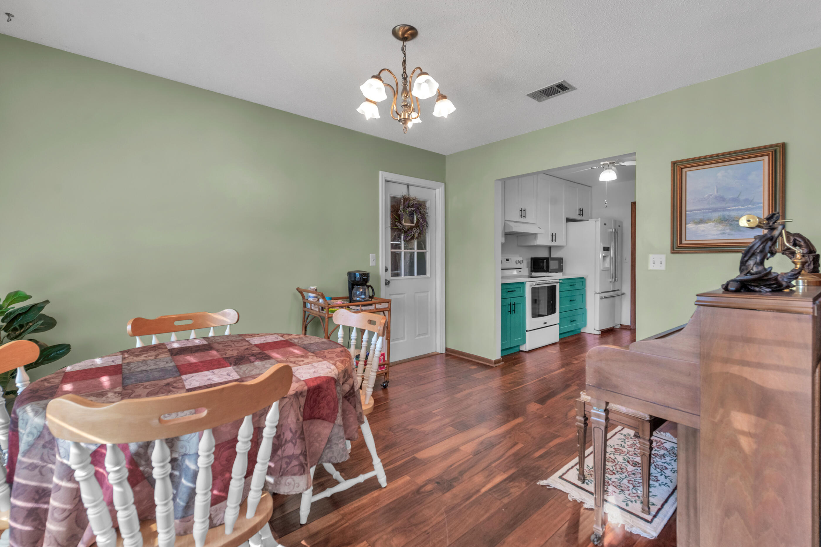 371 Echo Circle Fort Walton Beach, FL 32548 - Photo 7 of 36 a view of a dining room with furniture and wooden floor
