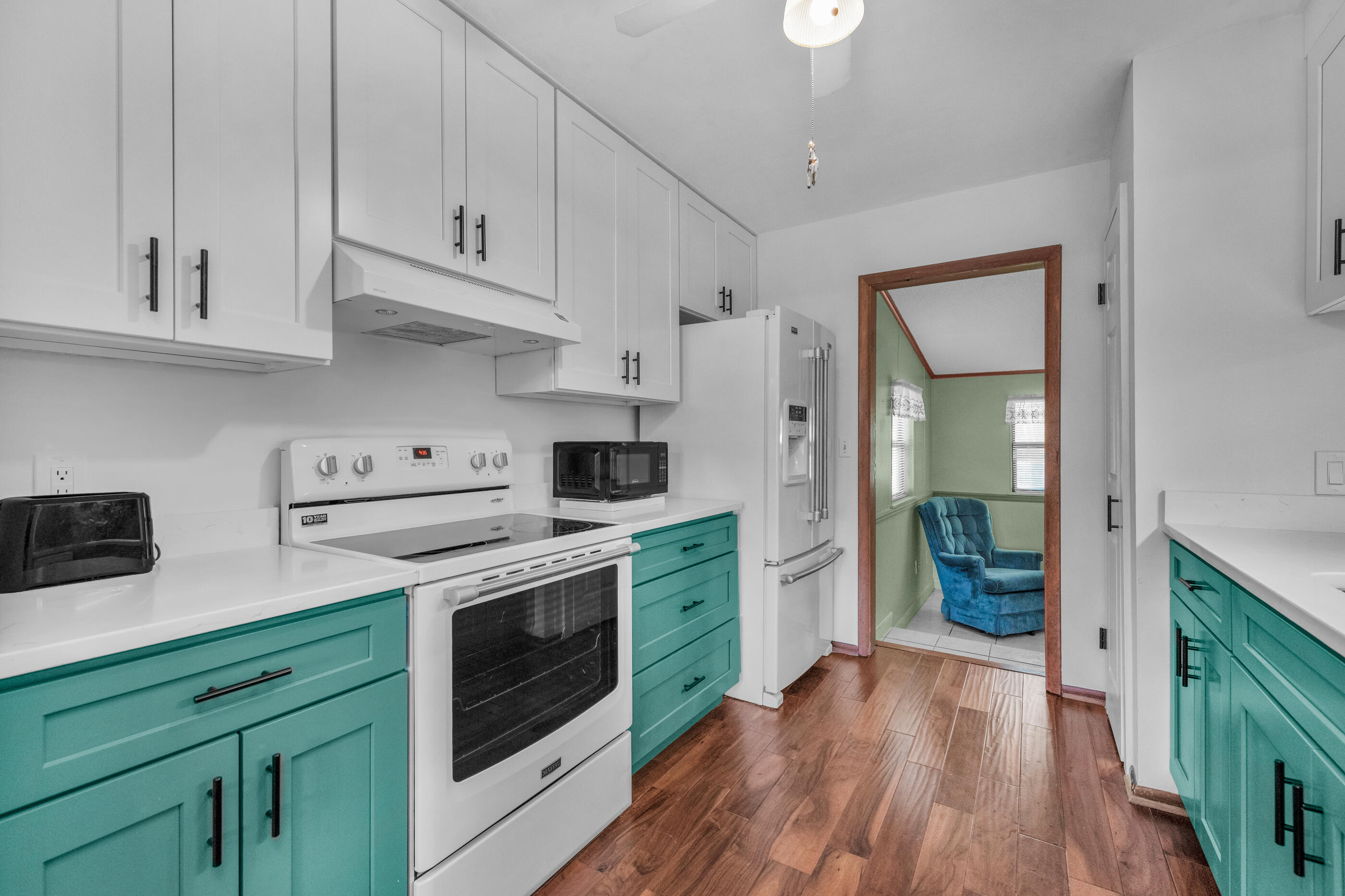 371 Echo Circle Fort Walton Beach, FL 32548 - Photo 10 of 36 a kitchen with stainless steel appliances white cabinets and a stove top oven