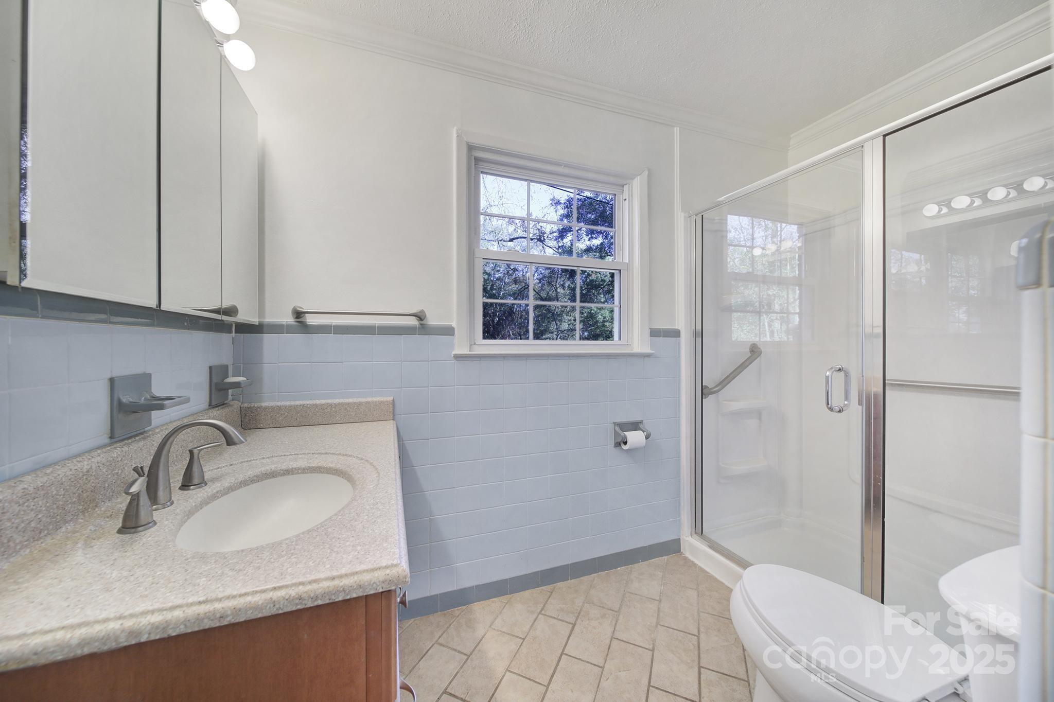 3987 Taxahaw Road Lancaster, SC 29720 - Photo 12 of 29 a bathroom with a sink toilet and shower